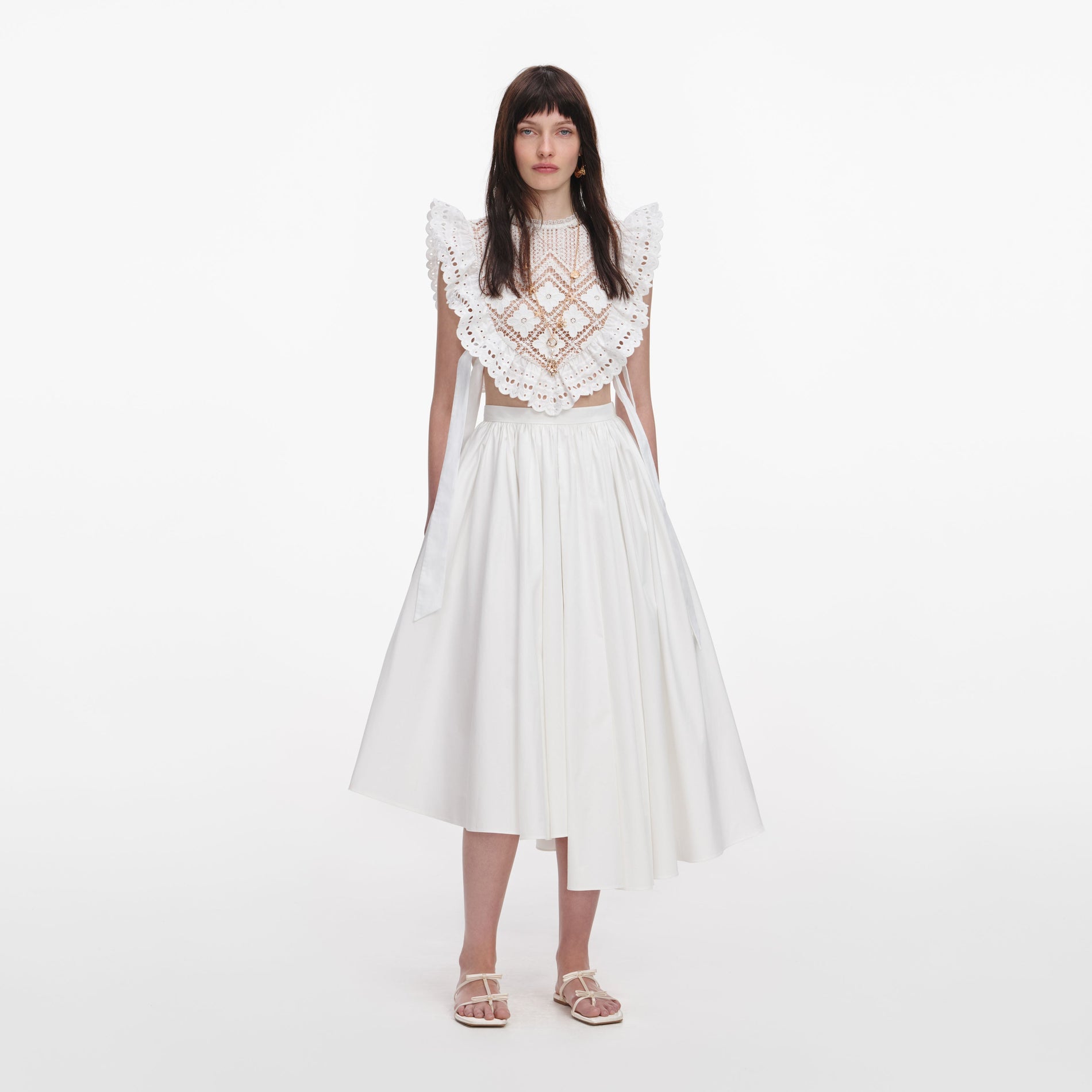 Front view of a woman wearing the White Crochet Lace Crop Top