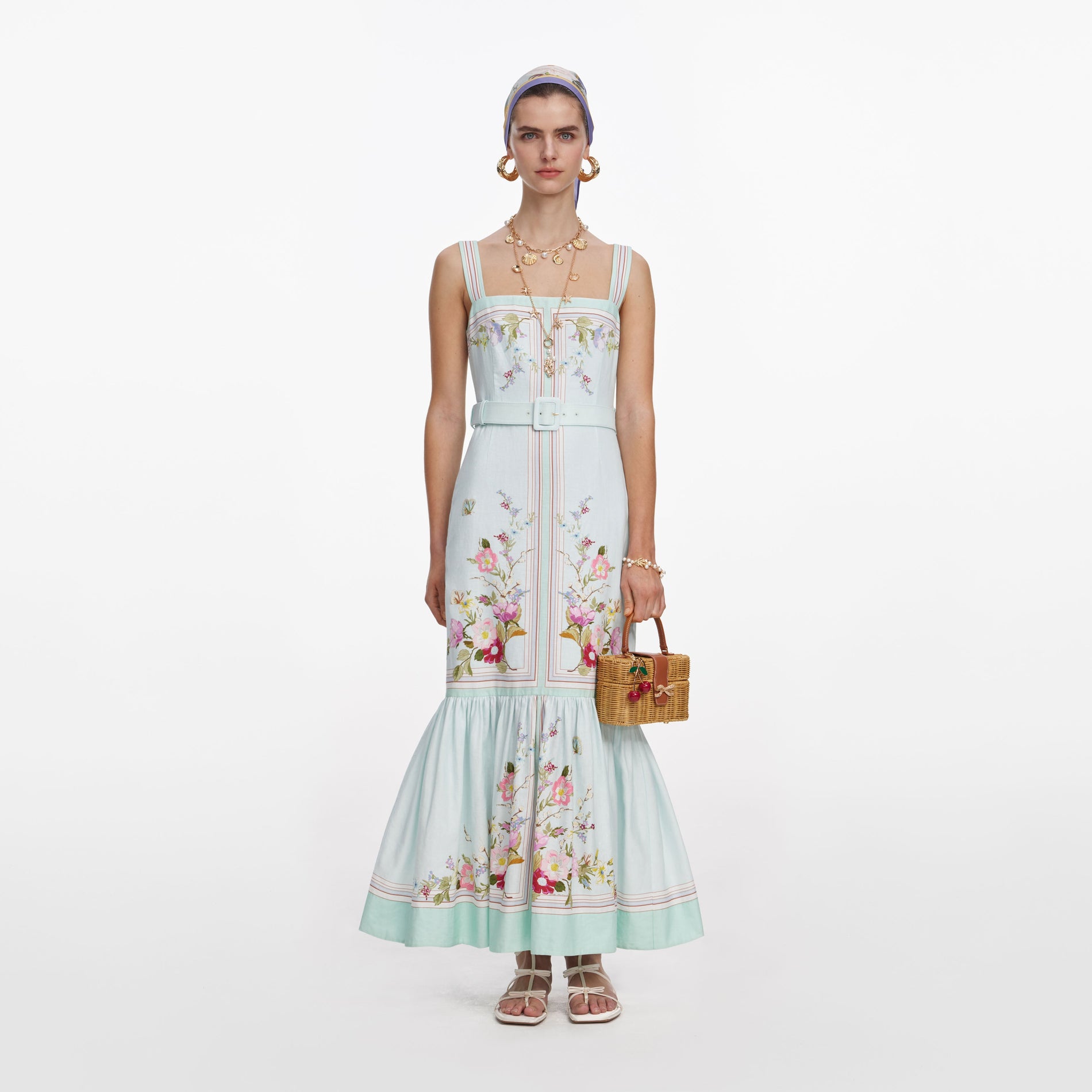 Front view of a woman wearing the Mint Floral Linen Midi Dress