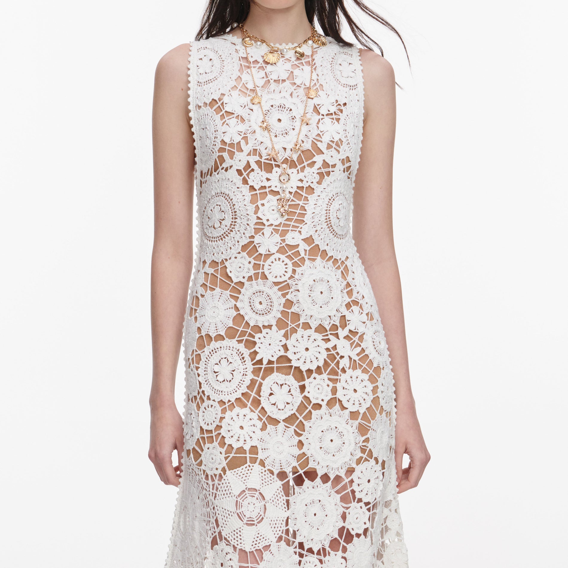 A close up of a woman wearing the White Crochet Maxi Dress