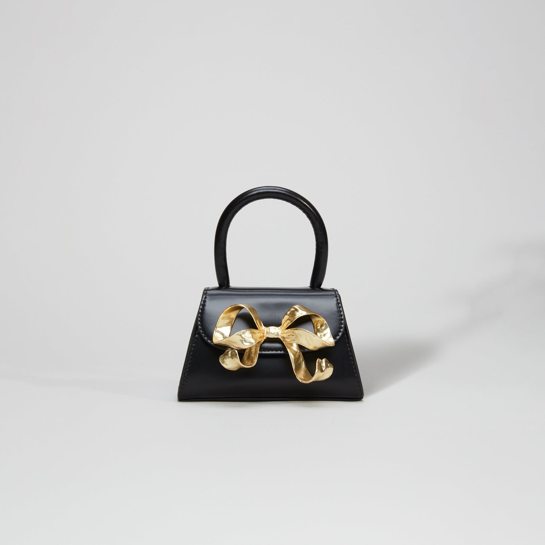 The Bow Micro in Black with Gold Hardware