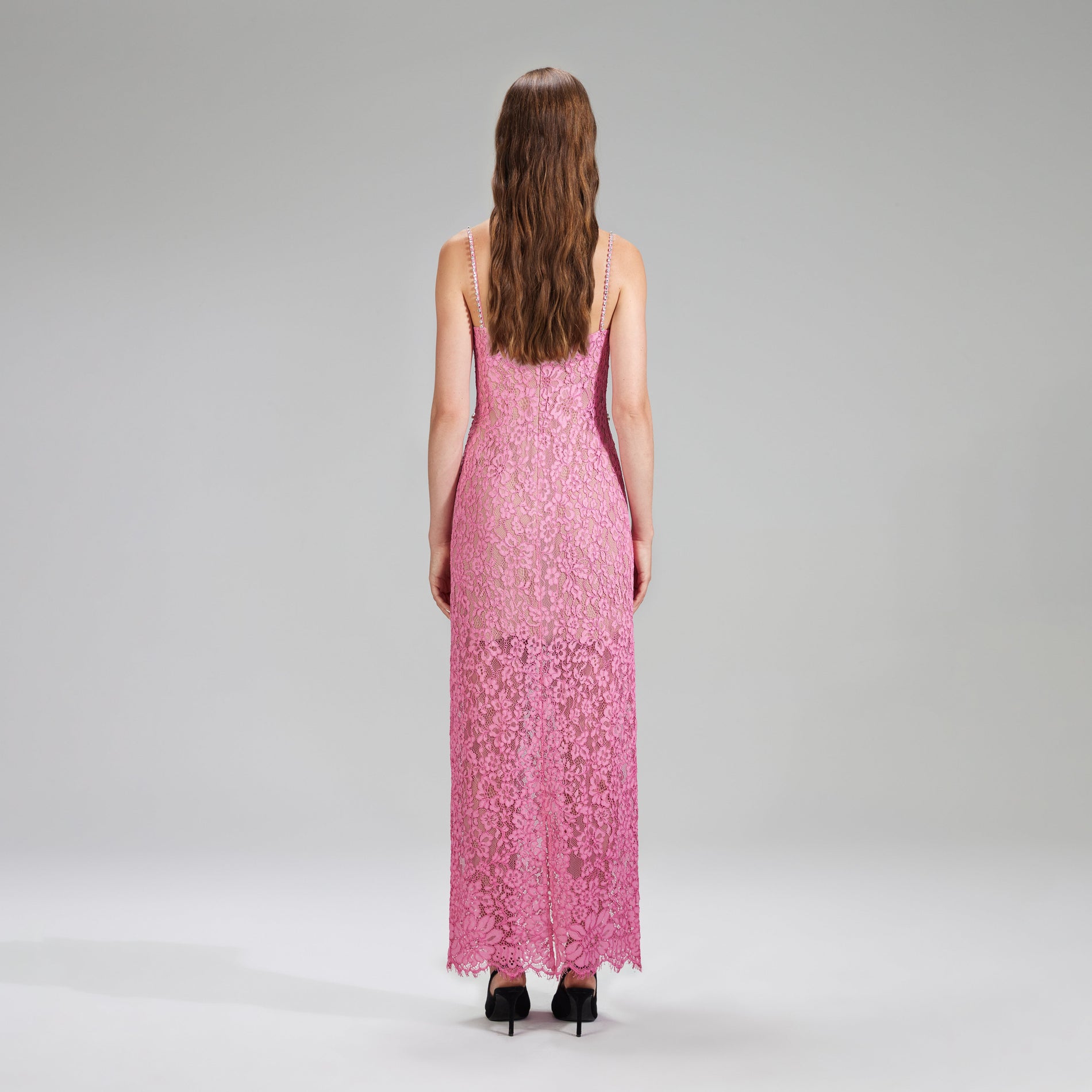 A woman wearing the Pink Corded Lace Midi Dress