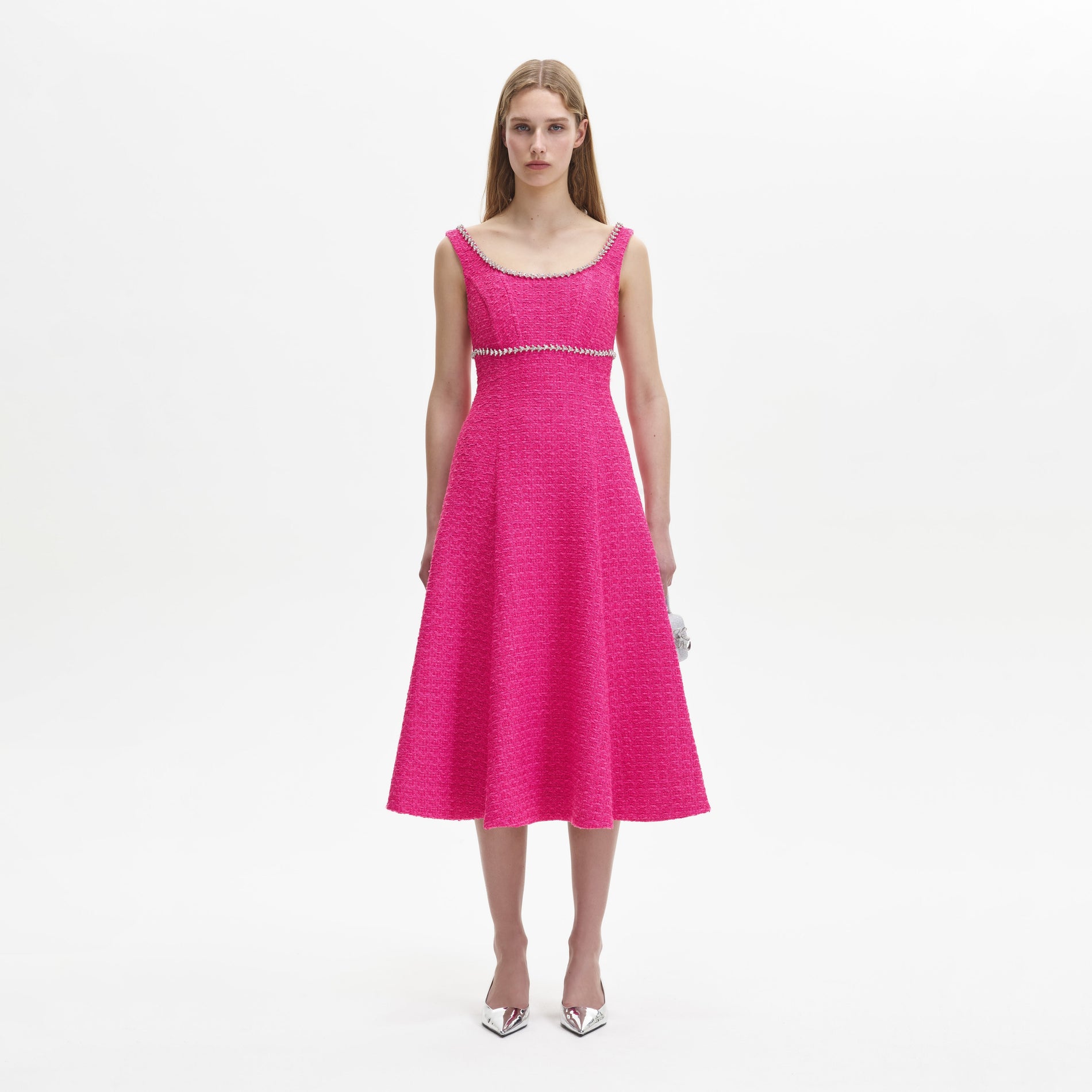 A woman wearing the Fuchsia Boucle Midi Dress