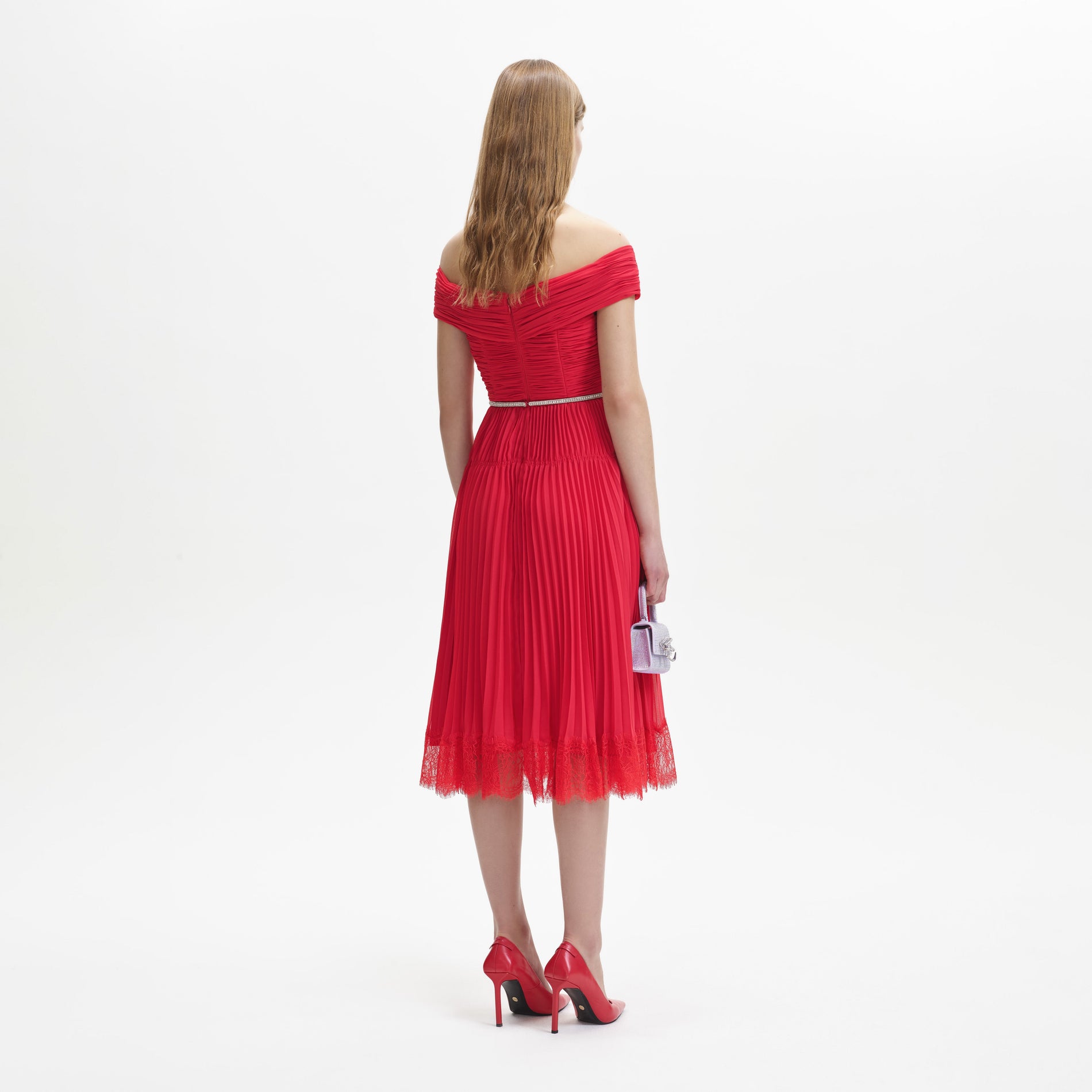 Back view of a woman wearing the Red Chiffon Off Shoulder Midi Dress