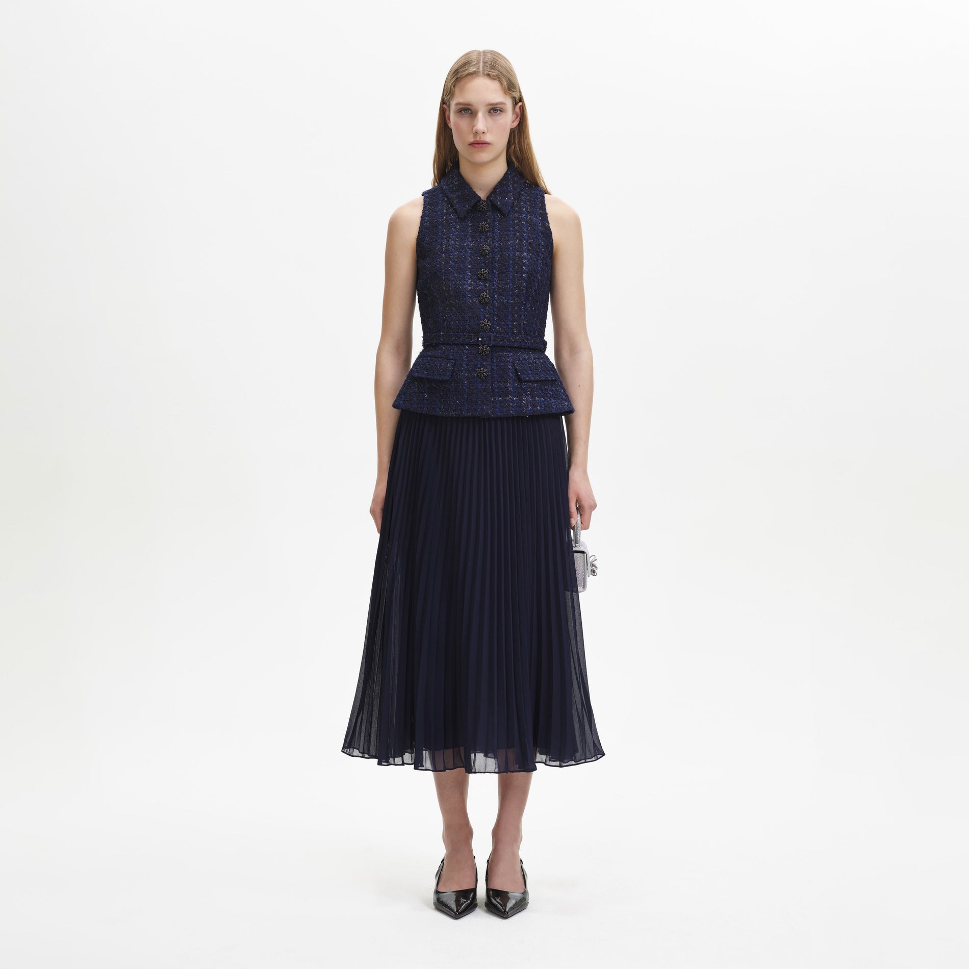 A woman wearing the Navy Metallic Boucle Chiffon Midi Dress