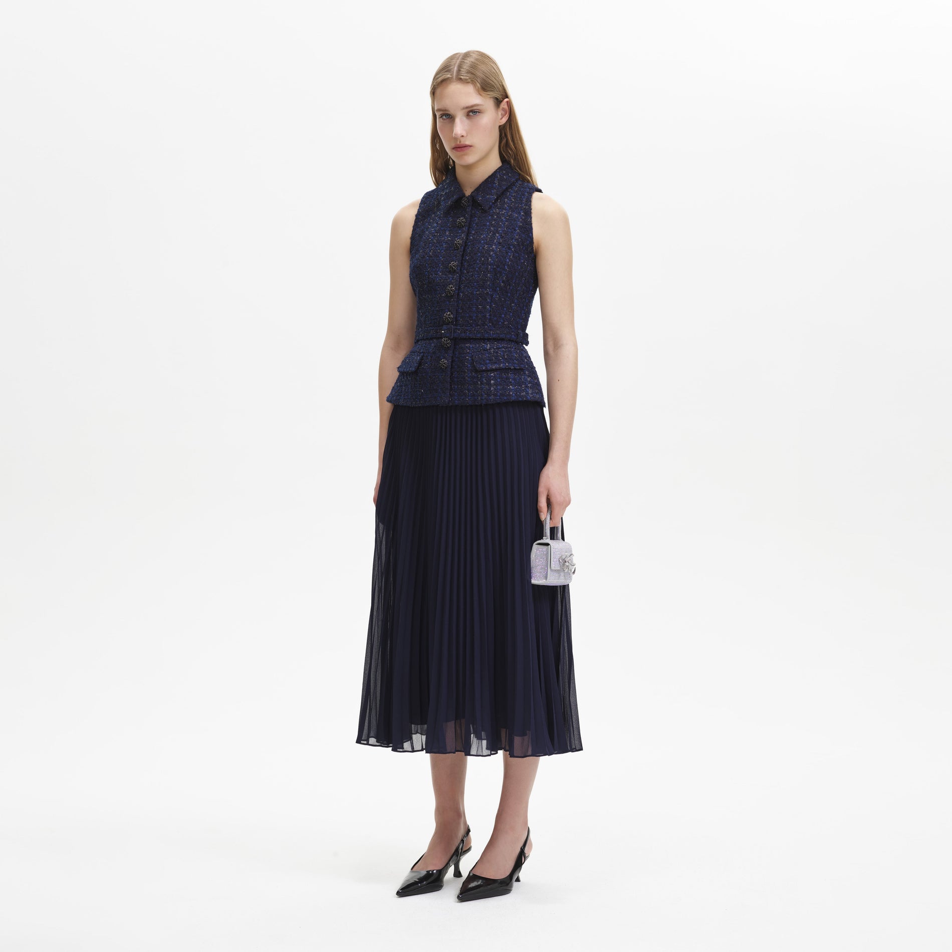 A woman wearing the Navy Metallic Boucle Chiffon Midi Dress