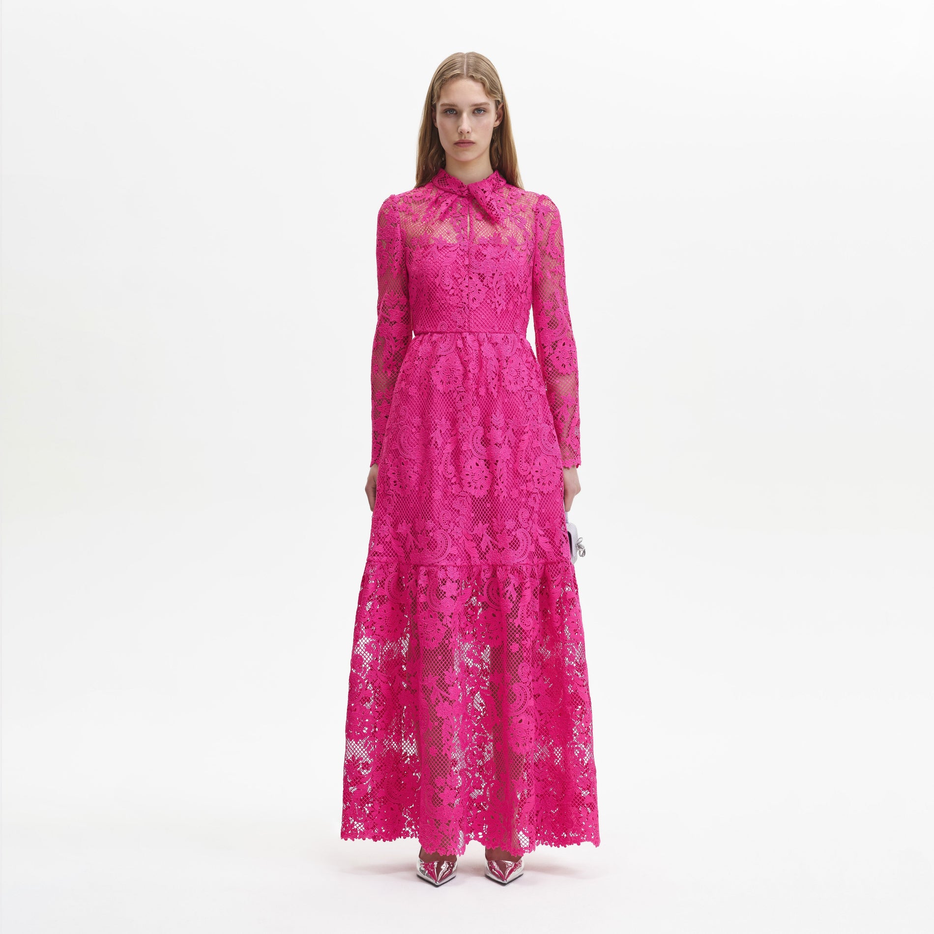 A woman wearing the Pink Lace Maxi Dress