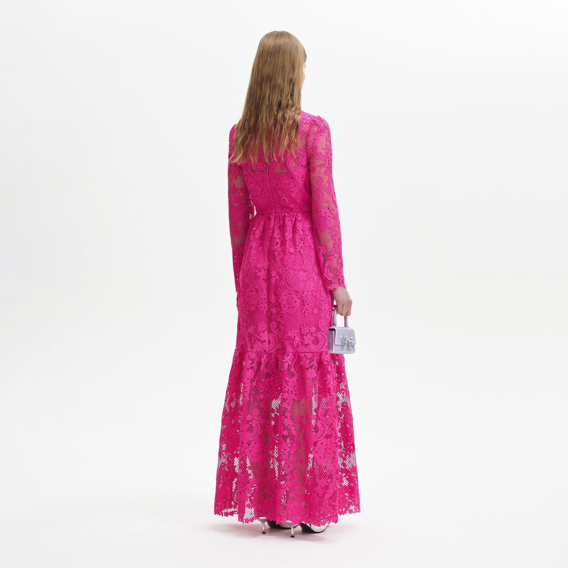 A woman wearing the Pink Lace Maxi Dress