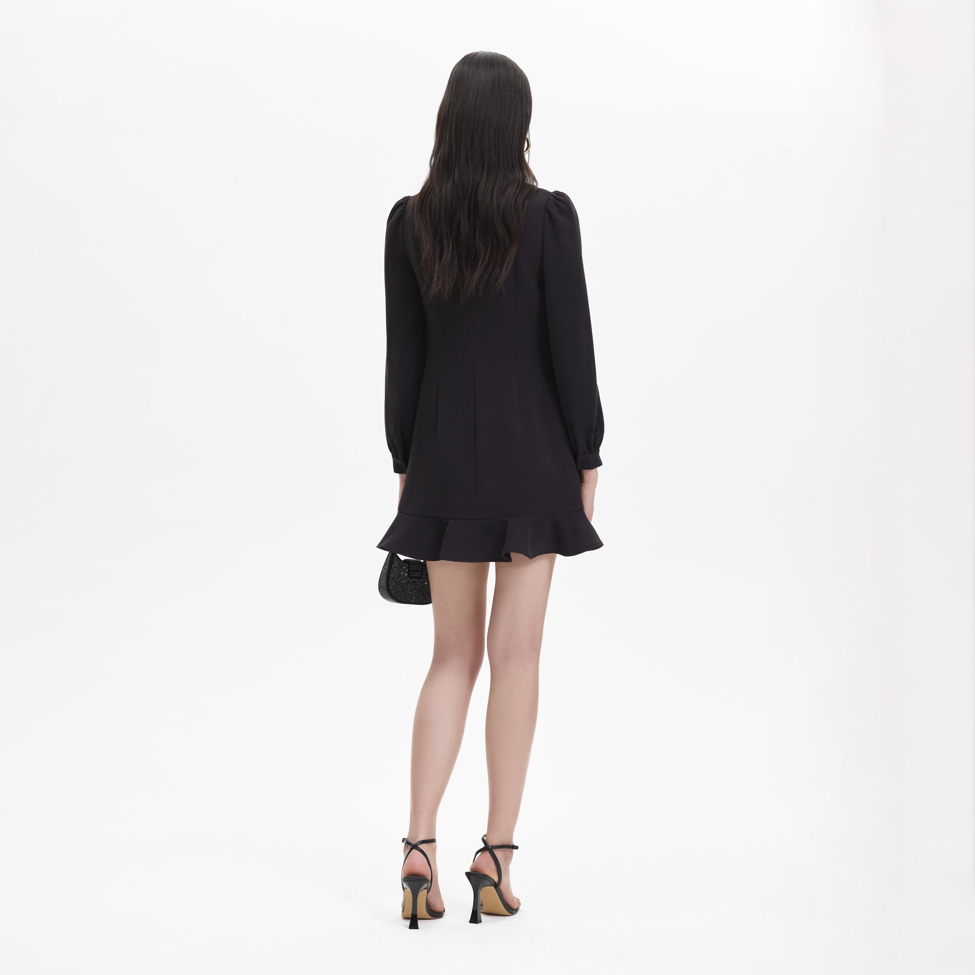 Back view of a woman wearing the Black Crepe Embellished Tunic