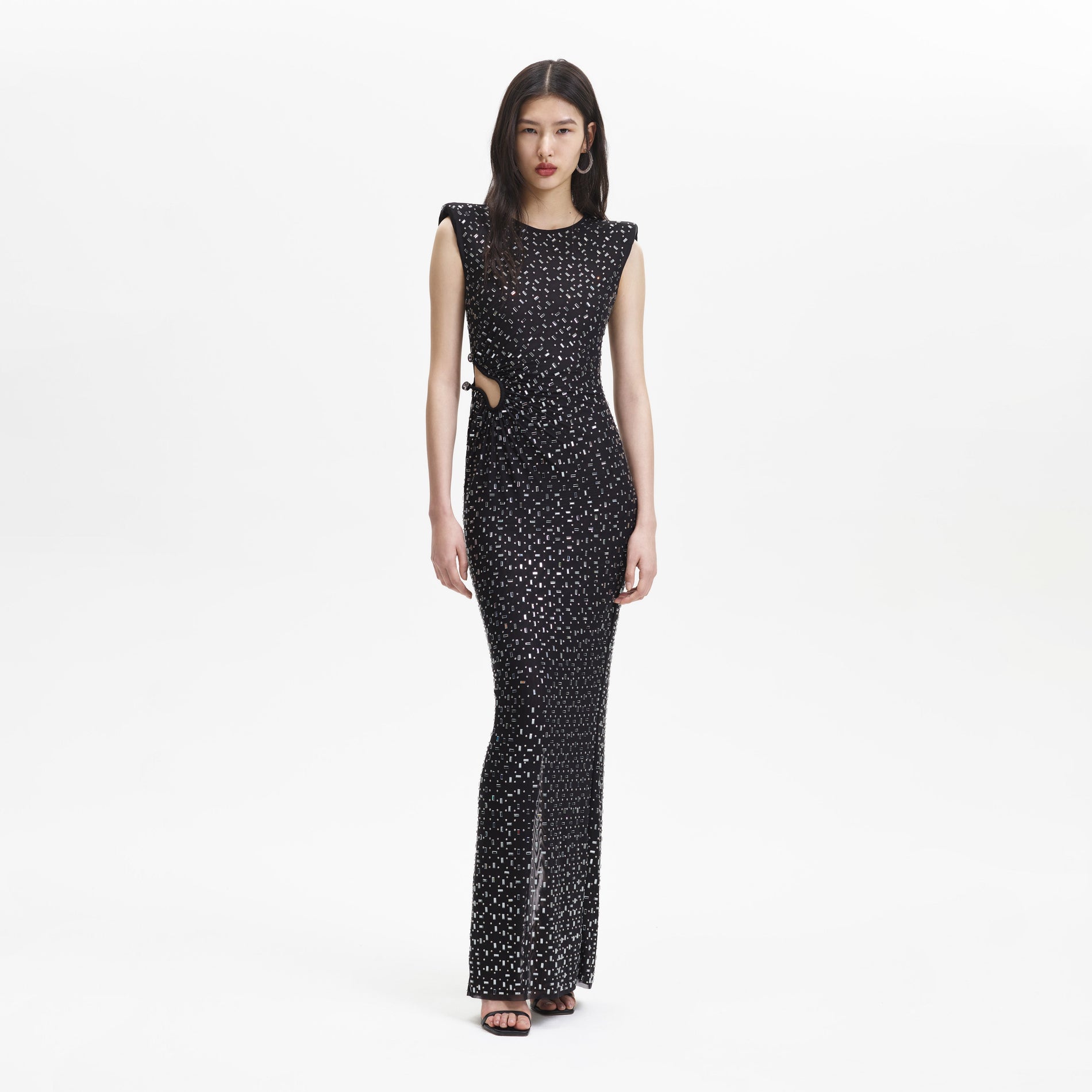 A woman wearing the Black Square Rhinestone Mesh Maxi Dress