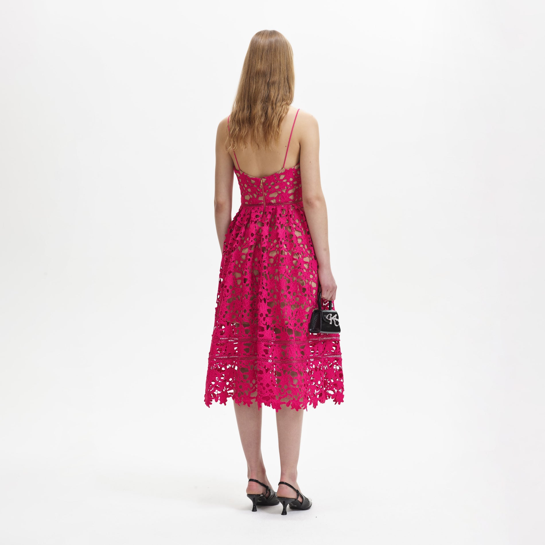 A woman wearing the Magenta Azaelea Midi Dress