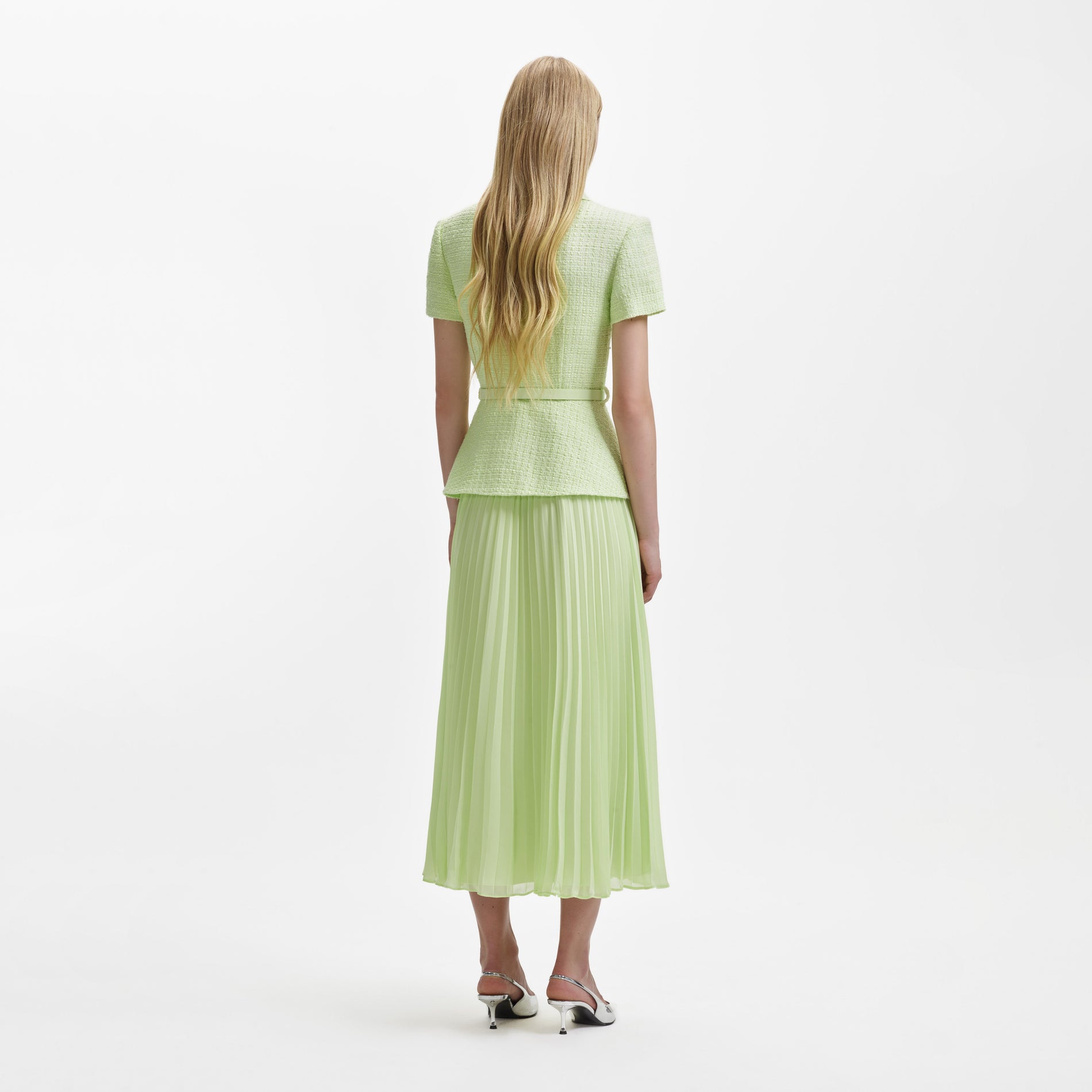 A woman wearing the Lime Boucle Collared Chiffon Midi Dress