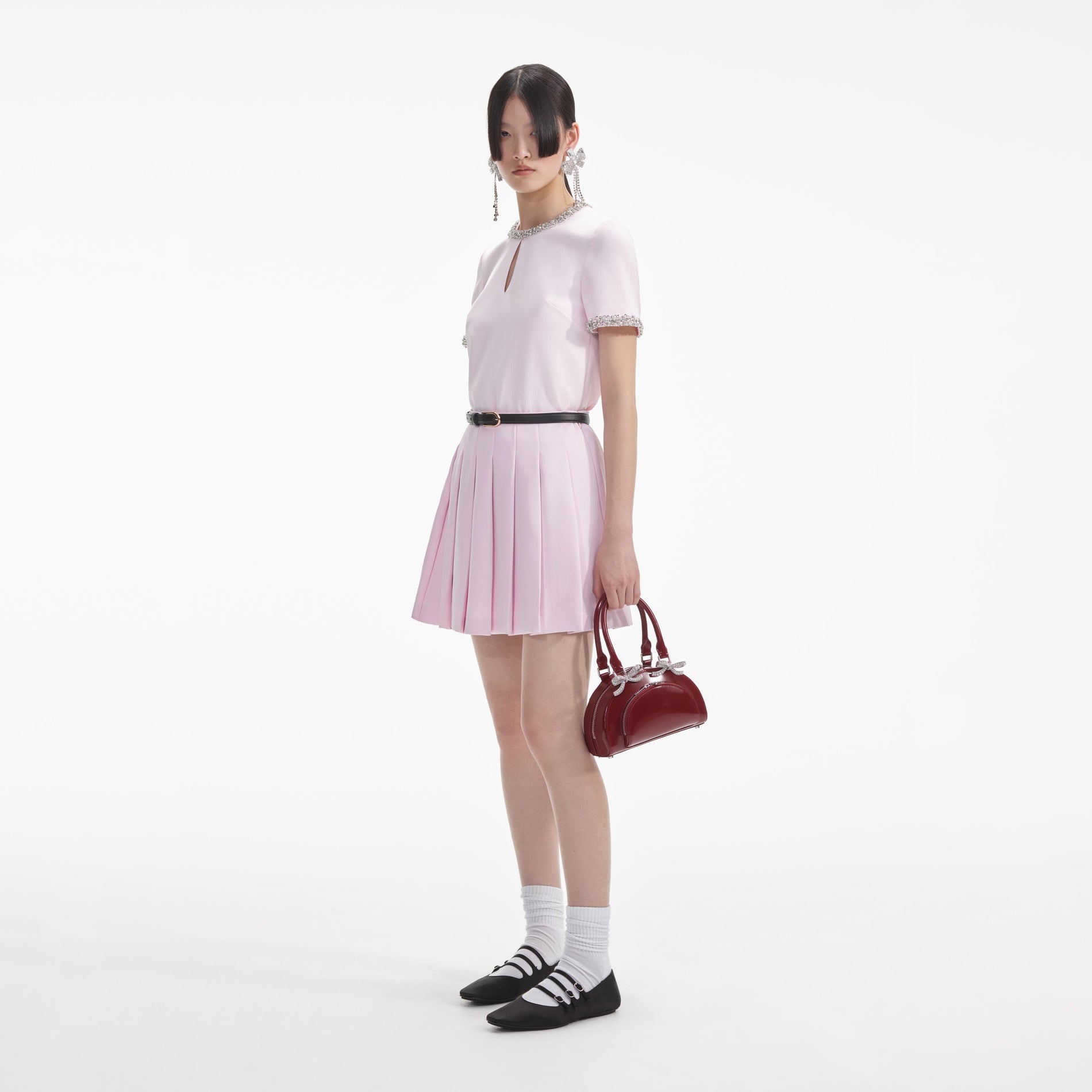 Side view of a woman wearing the Pink Satin Embellished Top