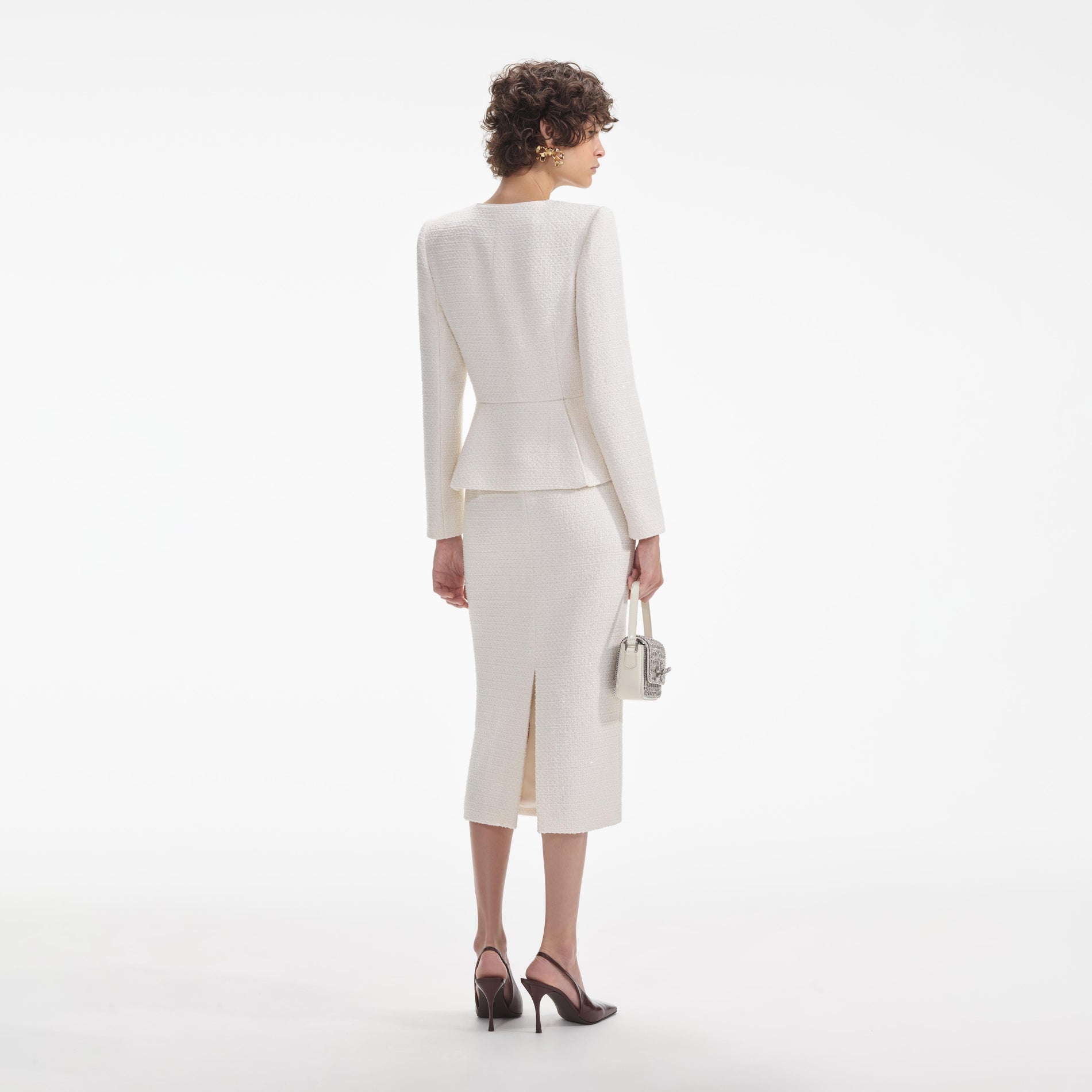 Back view of a woman wearing the White Cream Tinsel Boucle Midi Dress