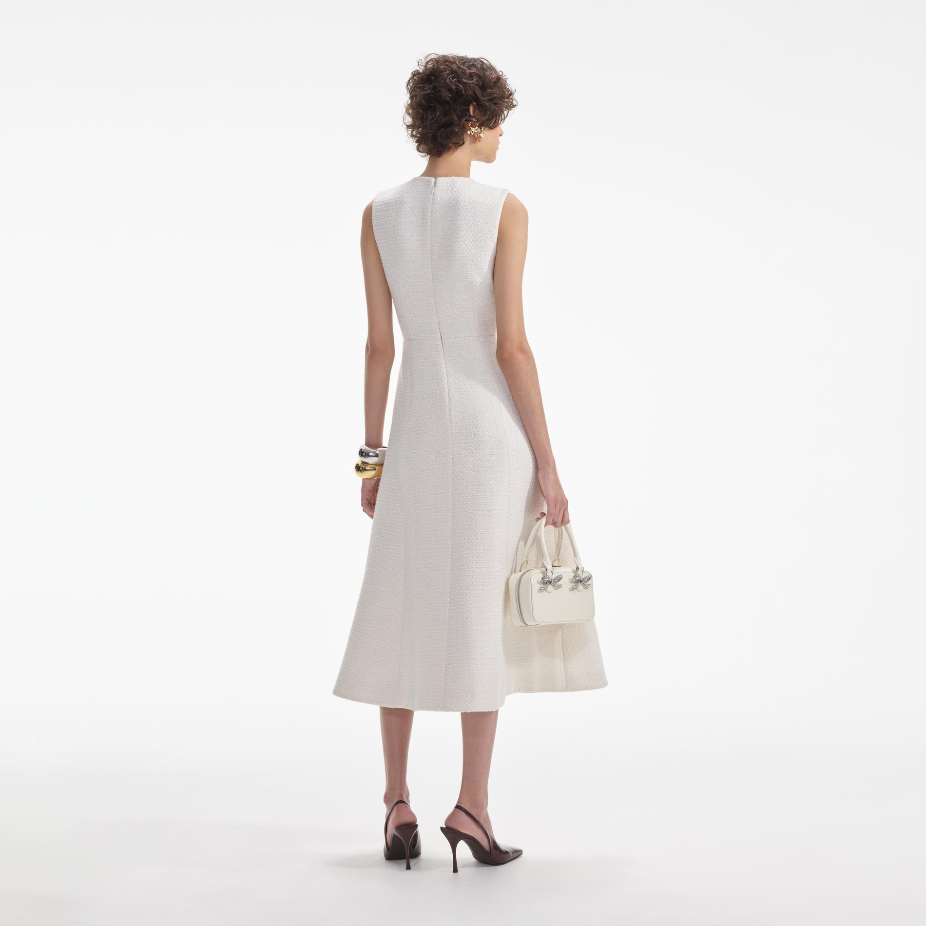 Back view of a woman wearing the White Cream Tinsel Boucle Buttoned Midi Dress