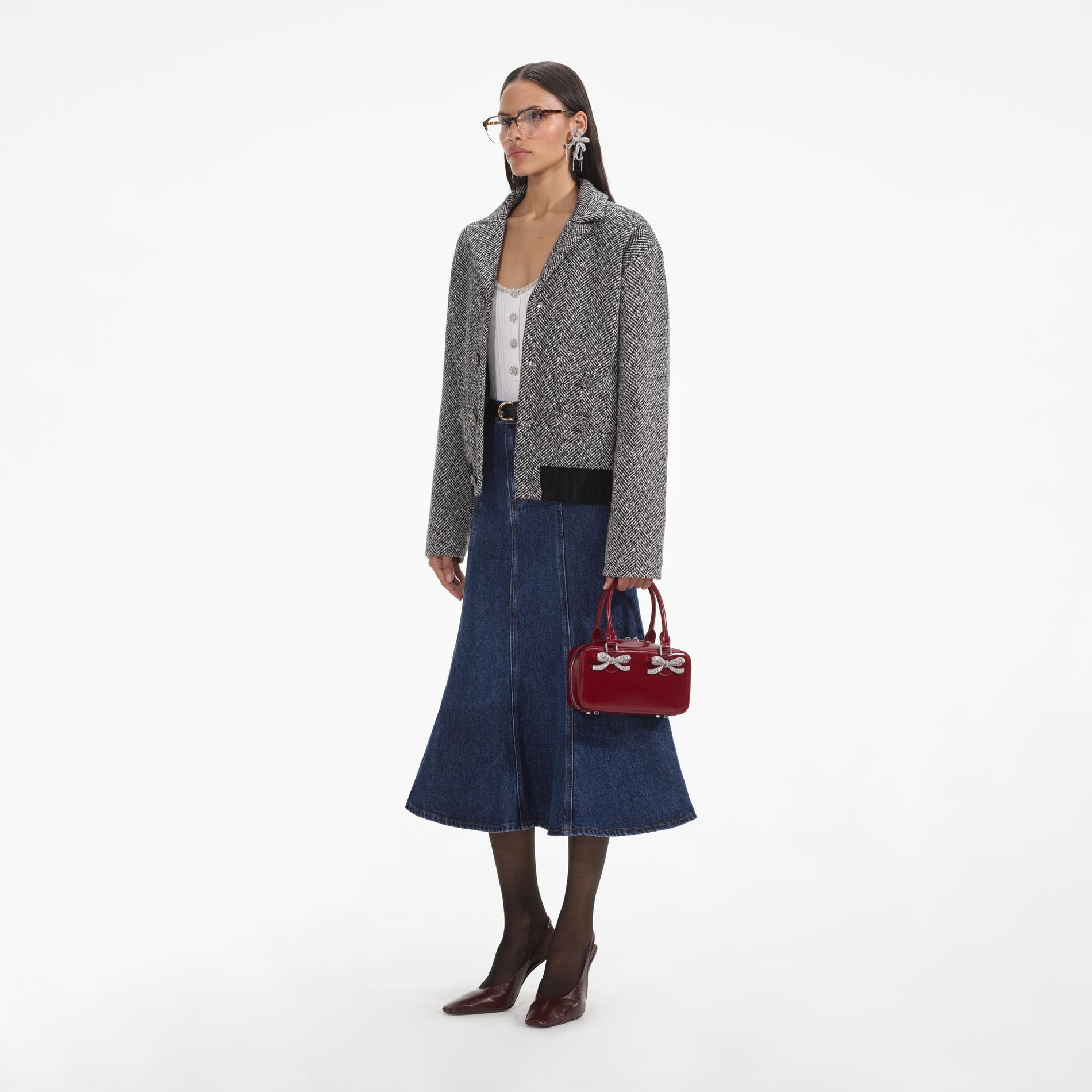 Side view of a woman wearing the Black Herringbone Bomber Jacket