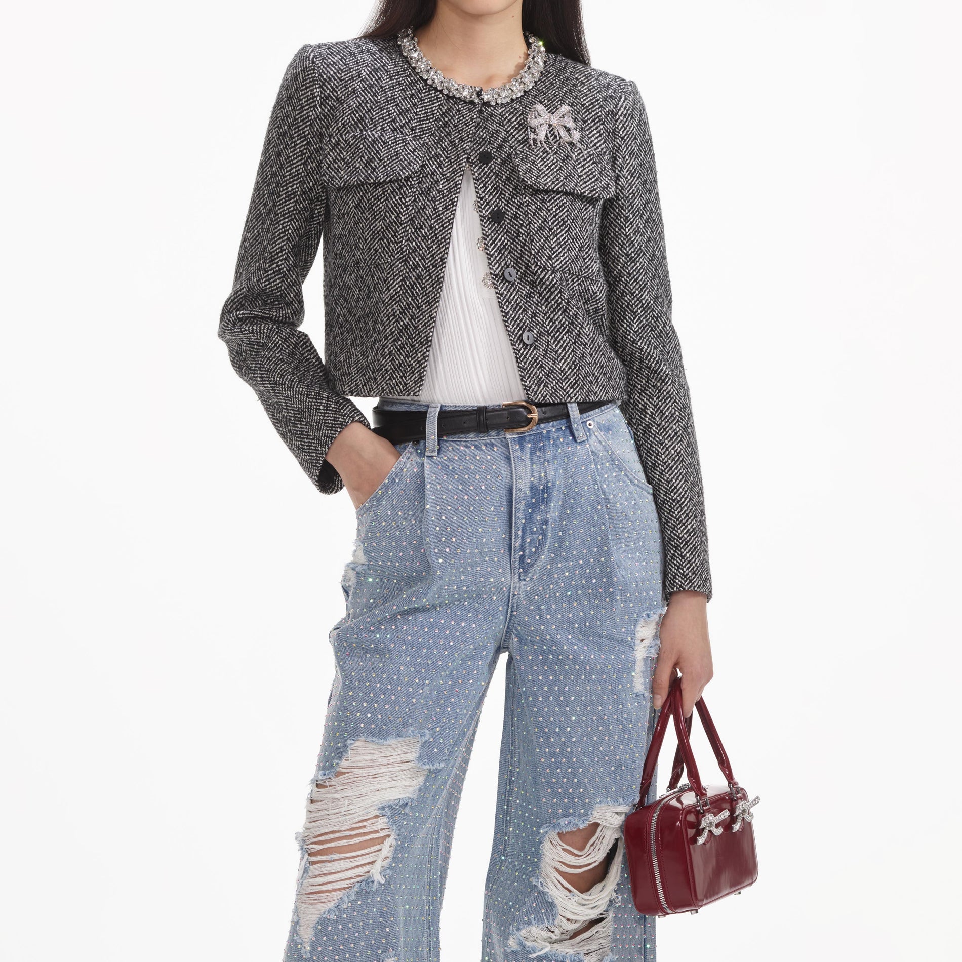 A close up of a woman wearing the Rhinestone Ombre Distressed Jeans