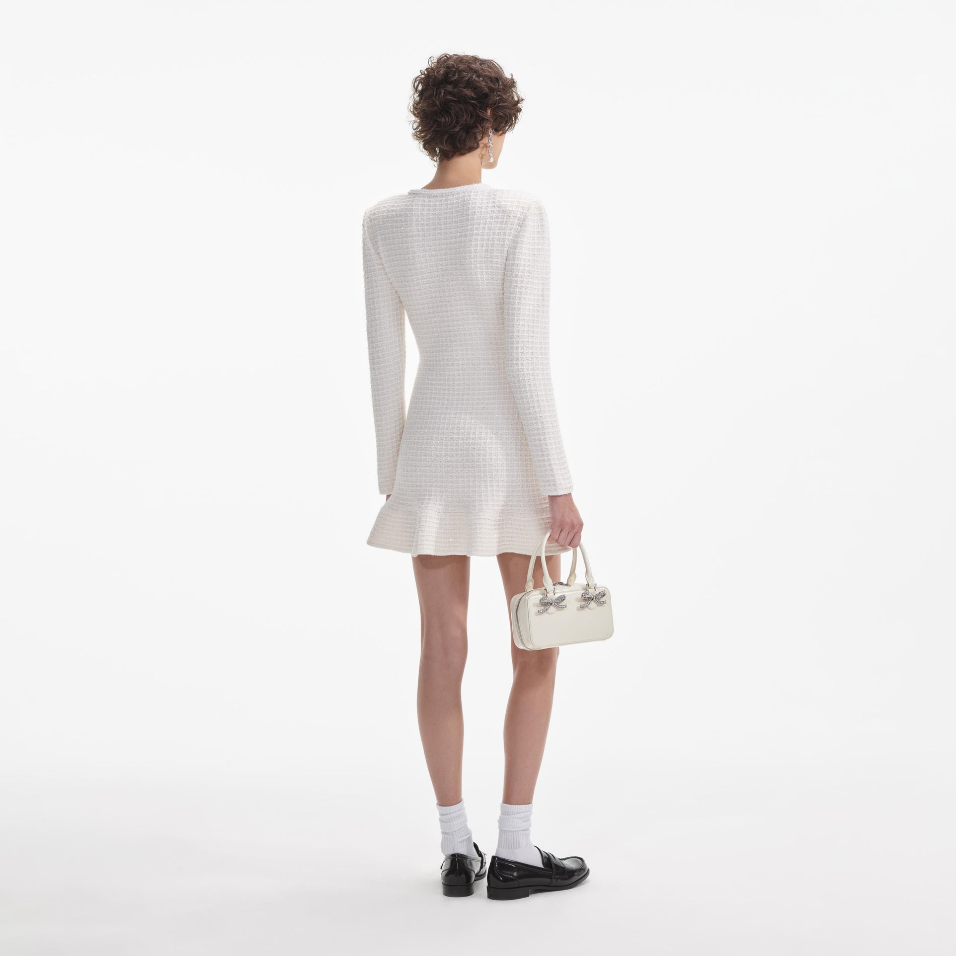 Back view of a woman wearing the White Cream Buttoned Knit Mini Dress