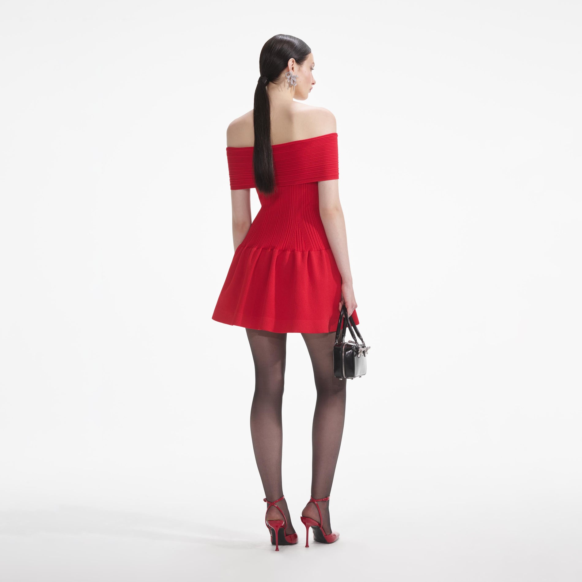 Back view of a woman wearing the White Red Knit Bow Mini Dress