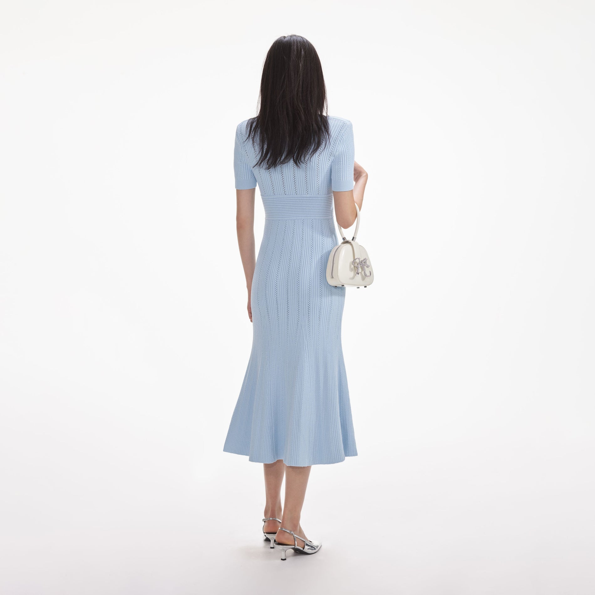 Back view of a woman wearing the White Blue Pointelle Knit Midi Dress