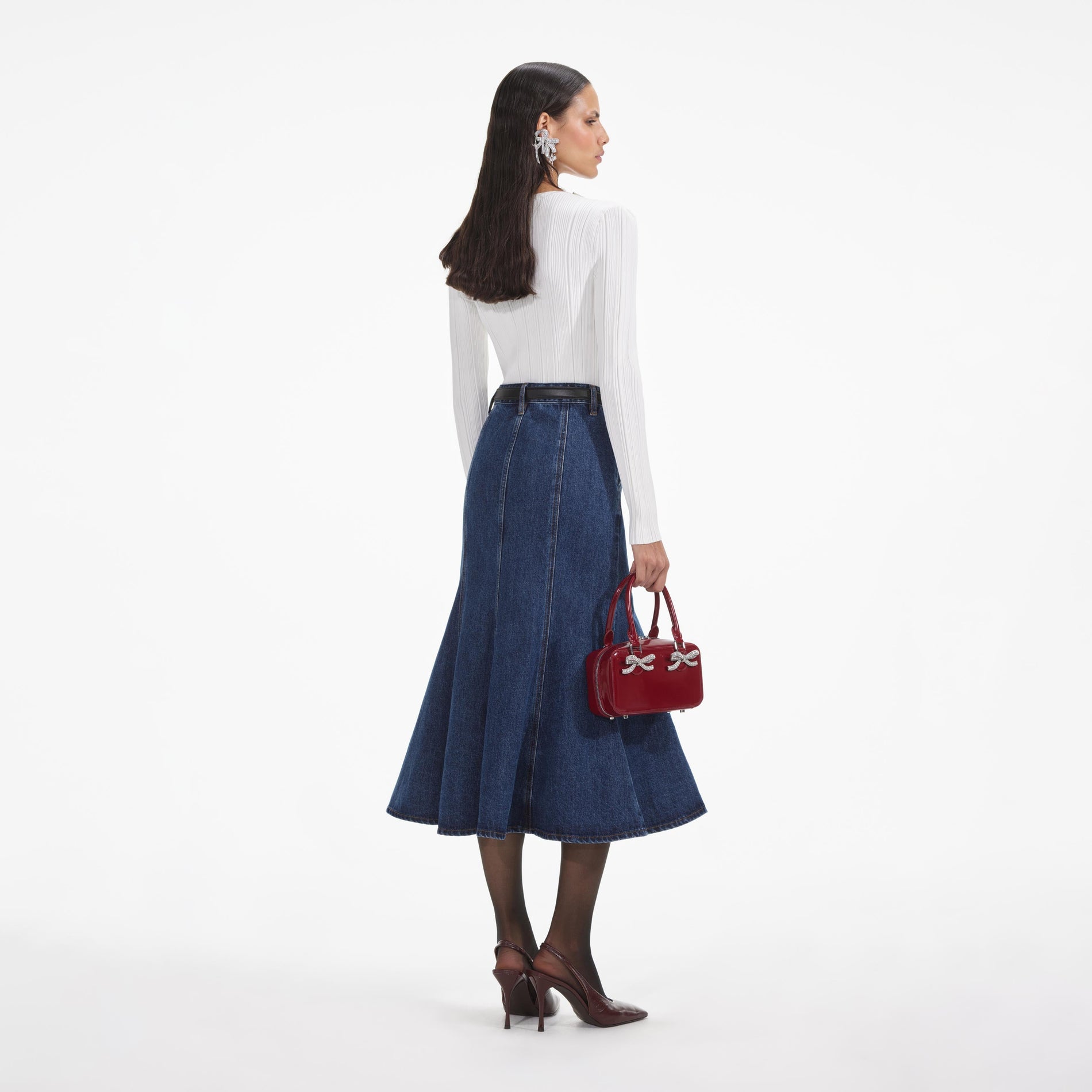 Back view of a woman wearing the White White Embellished Knit Top