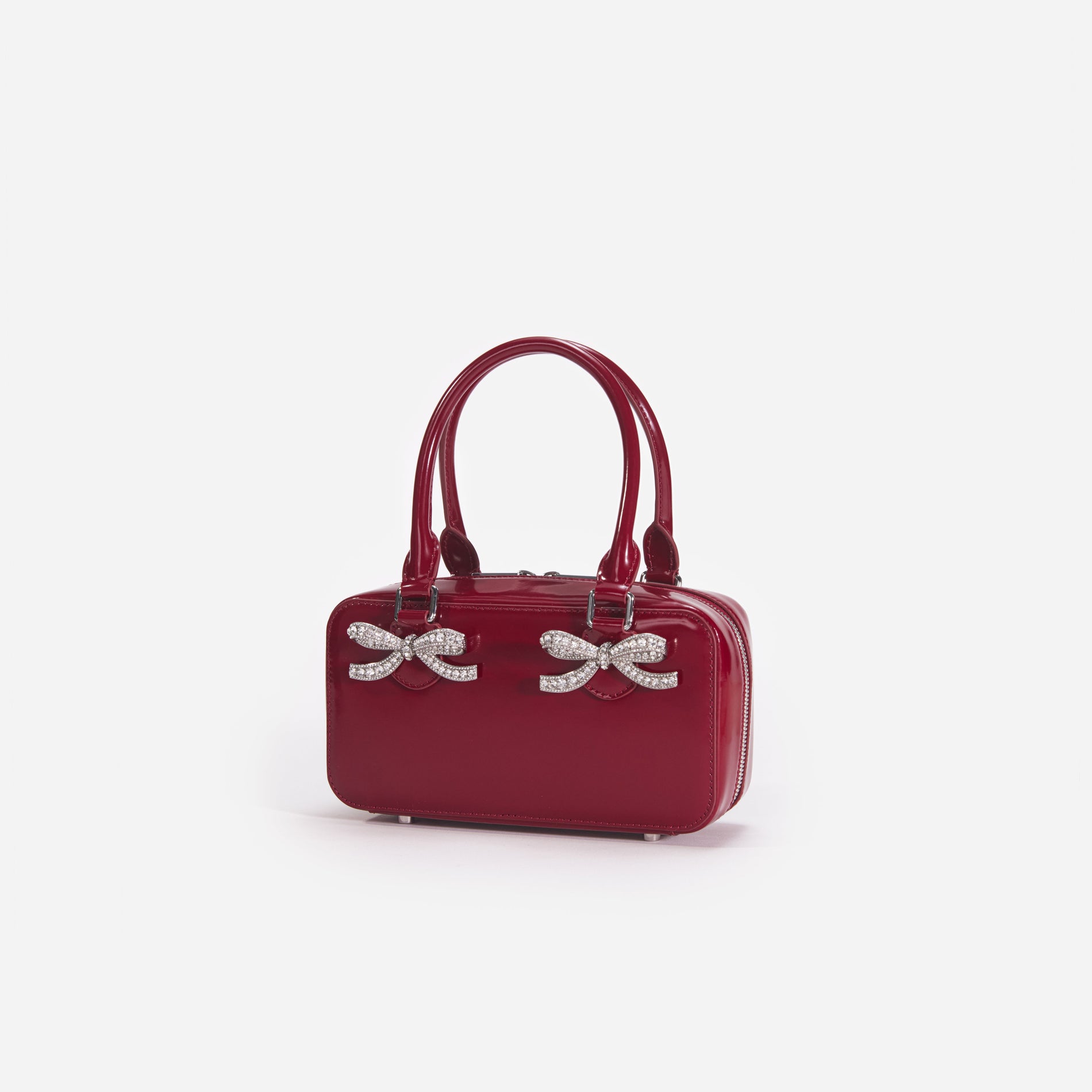 Side view of a woman wearing the Burgundy Leather Mini Tote Bag