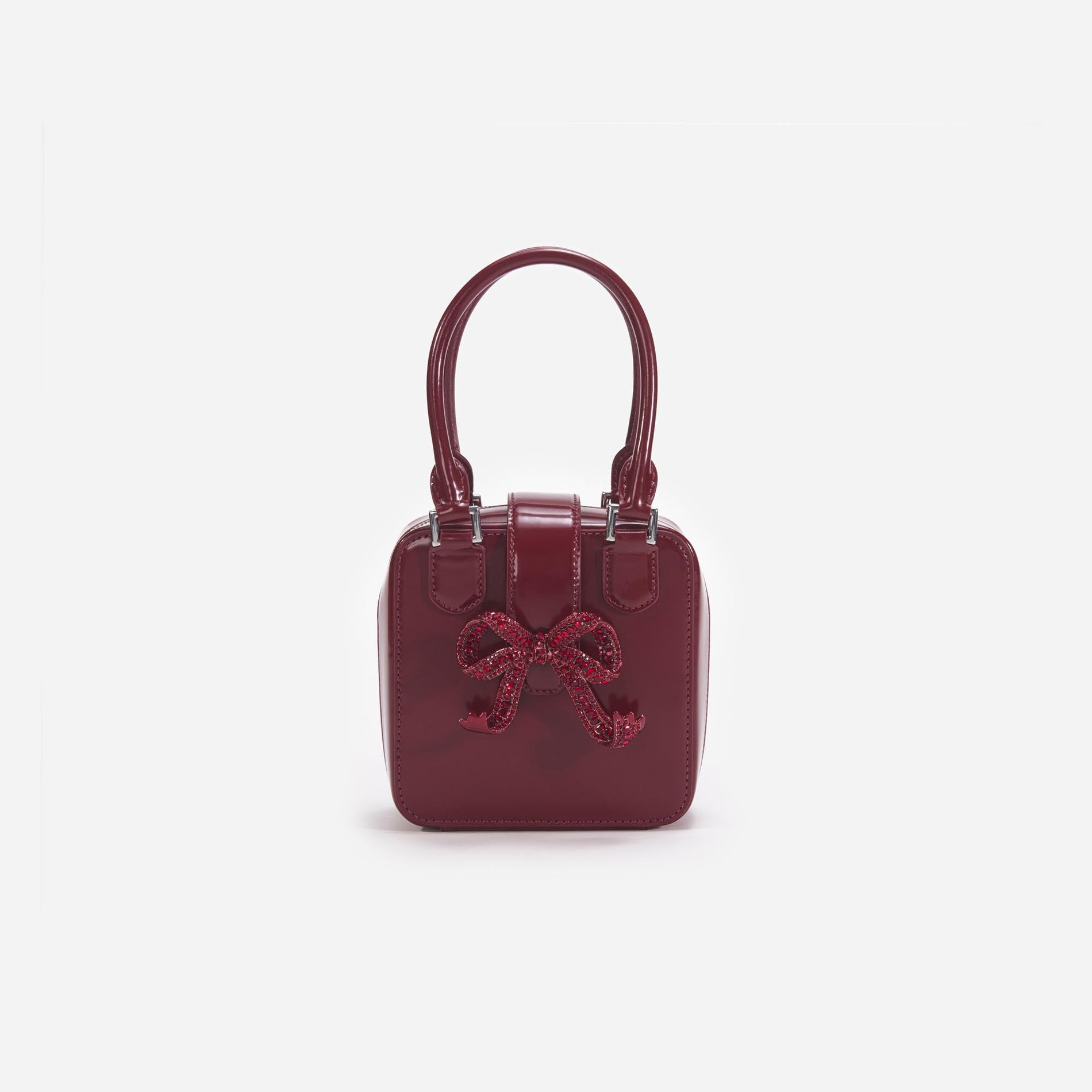 Front view of a woman wearing the Burgundy Leather Square Mini Tote Bag