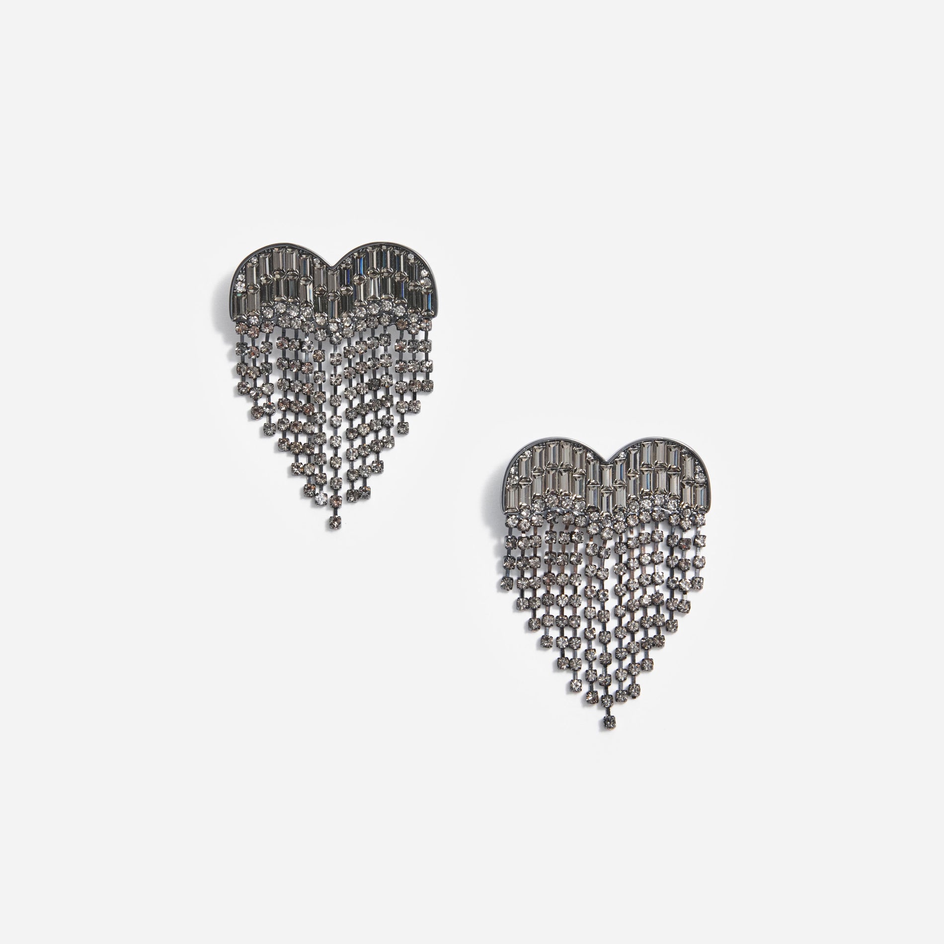 Front view of a woman wearing the Smoke Crystal Heart Earrings