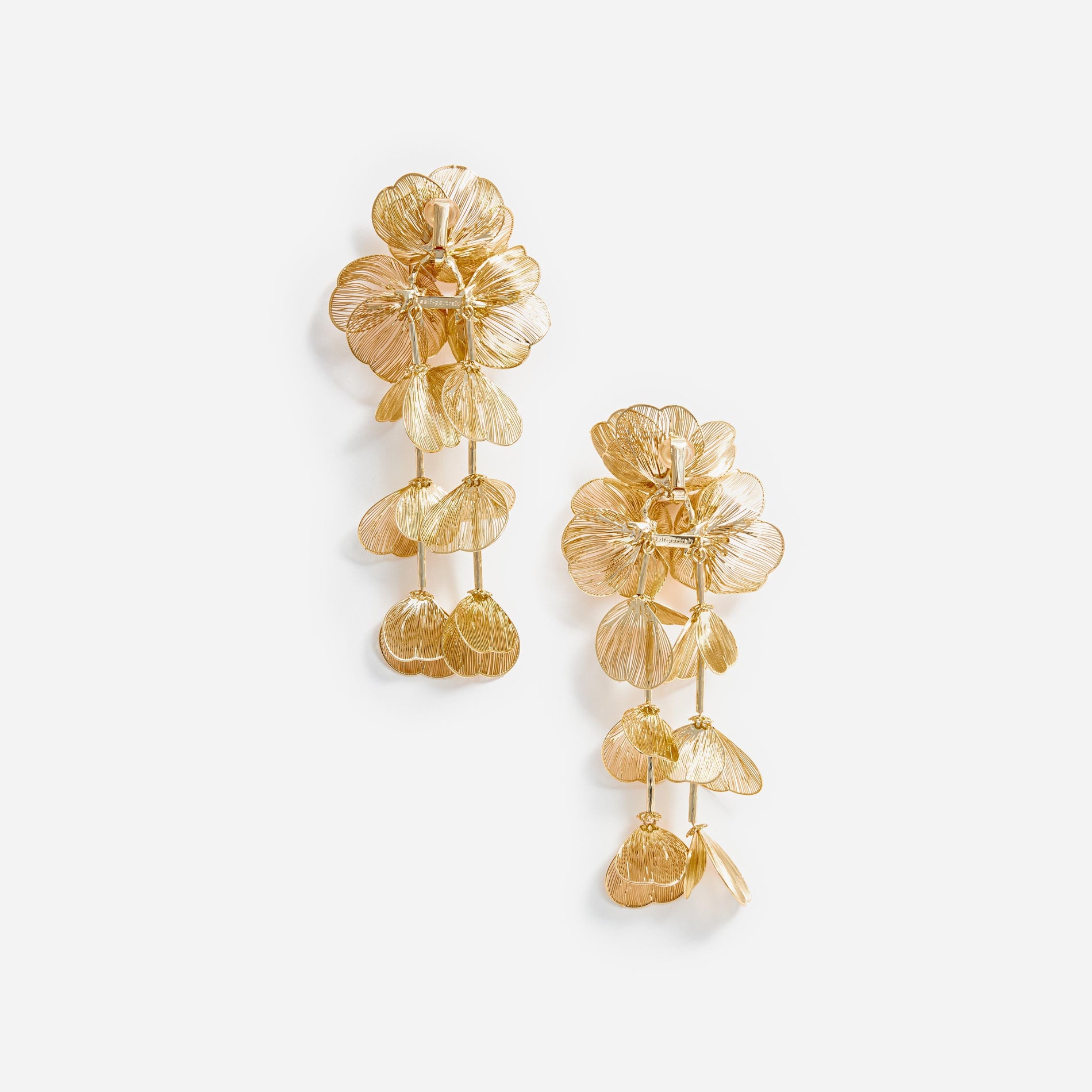 Side view of a woman wearing the Gold Floral Earrings