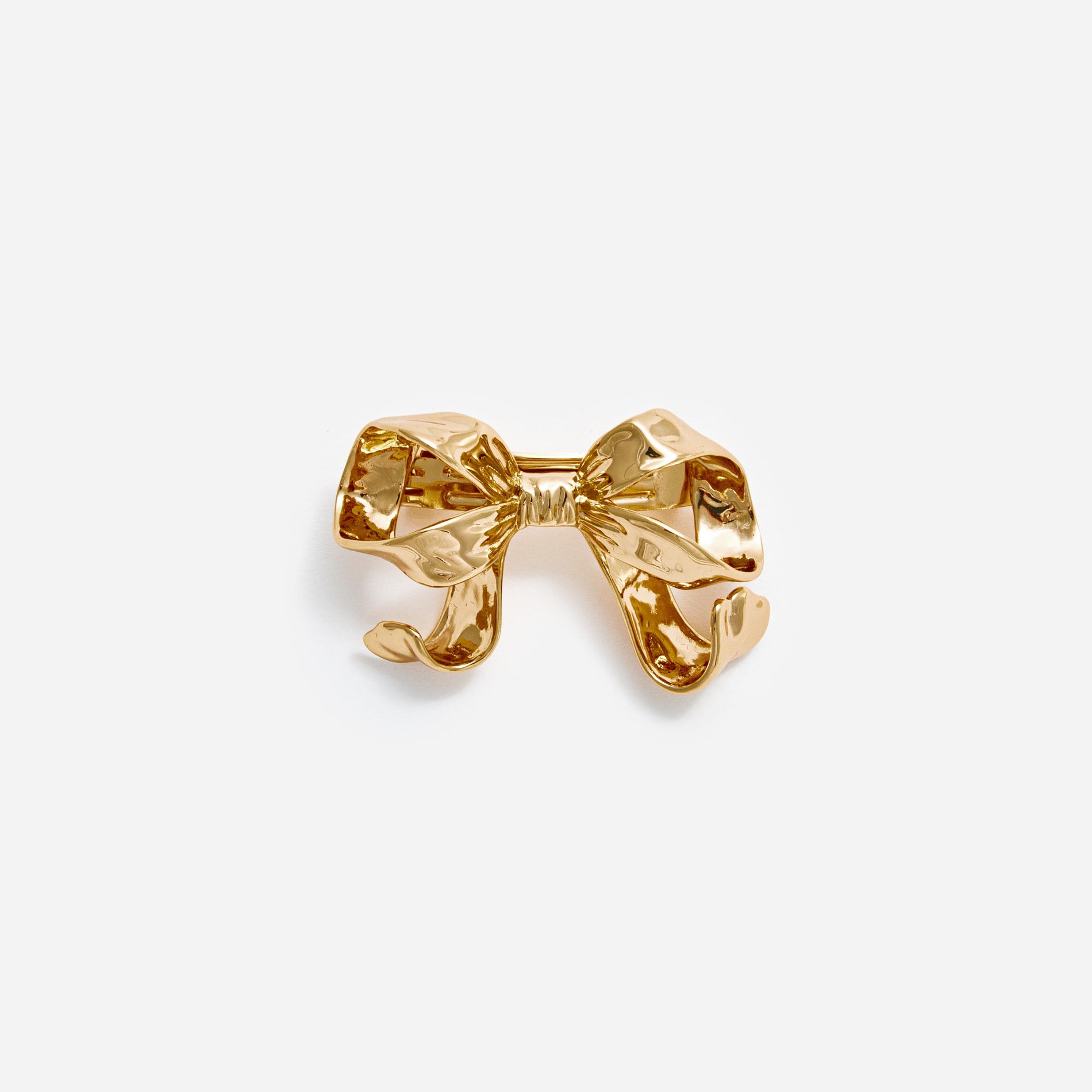 Front view of a woman wearing the Gold Bow Hair Clip
