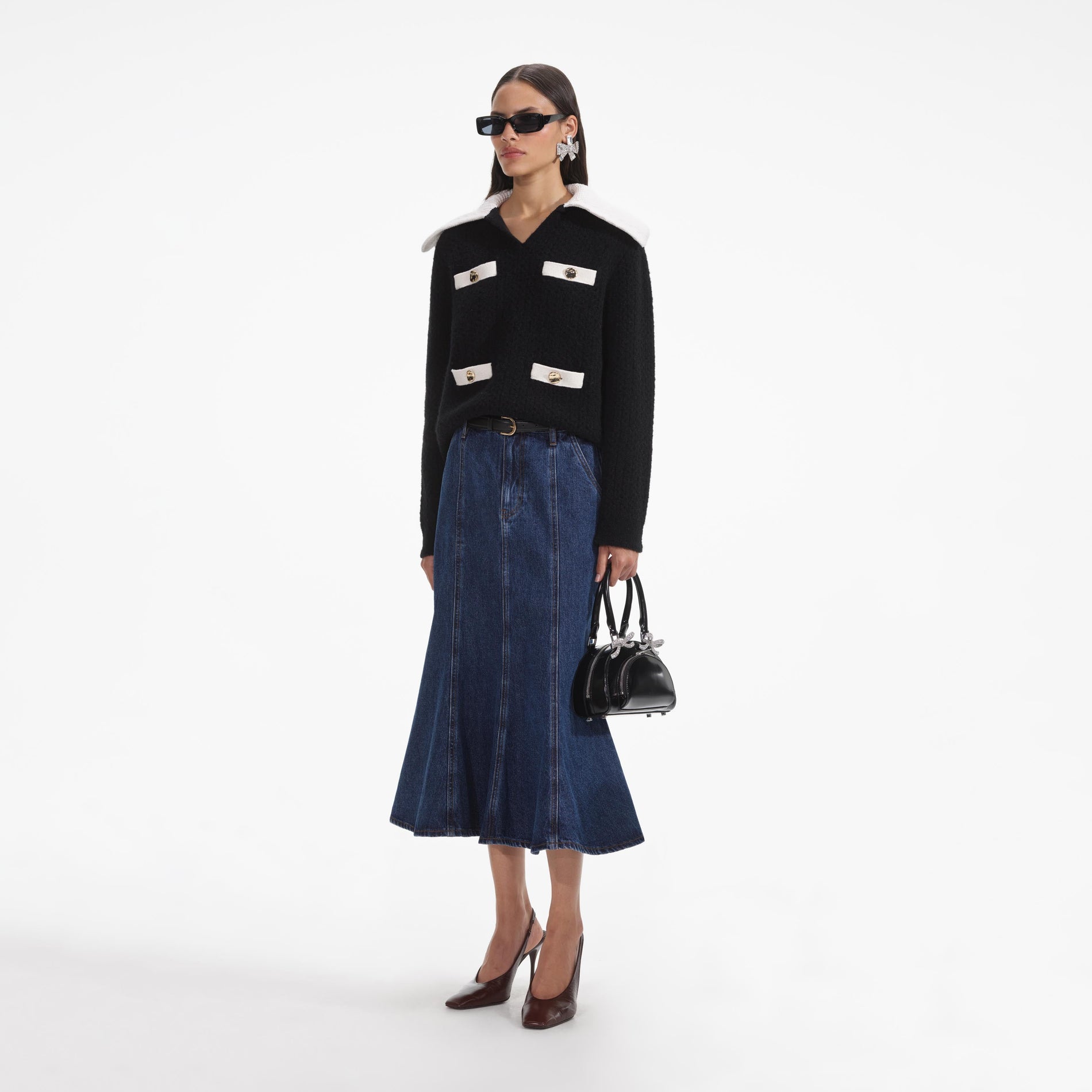 Side view of a woman wearing the Black Cashmere Blend Oversized Jumper