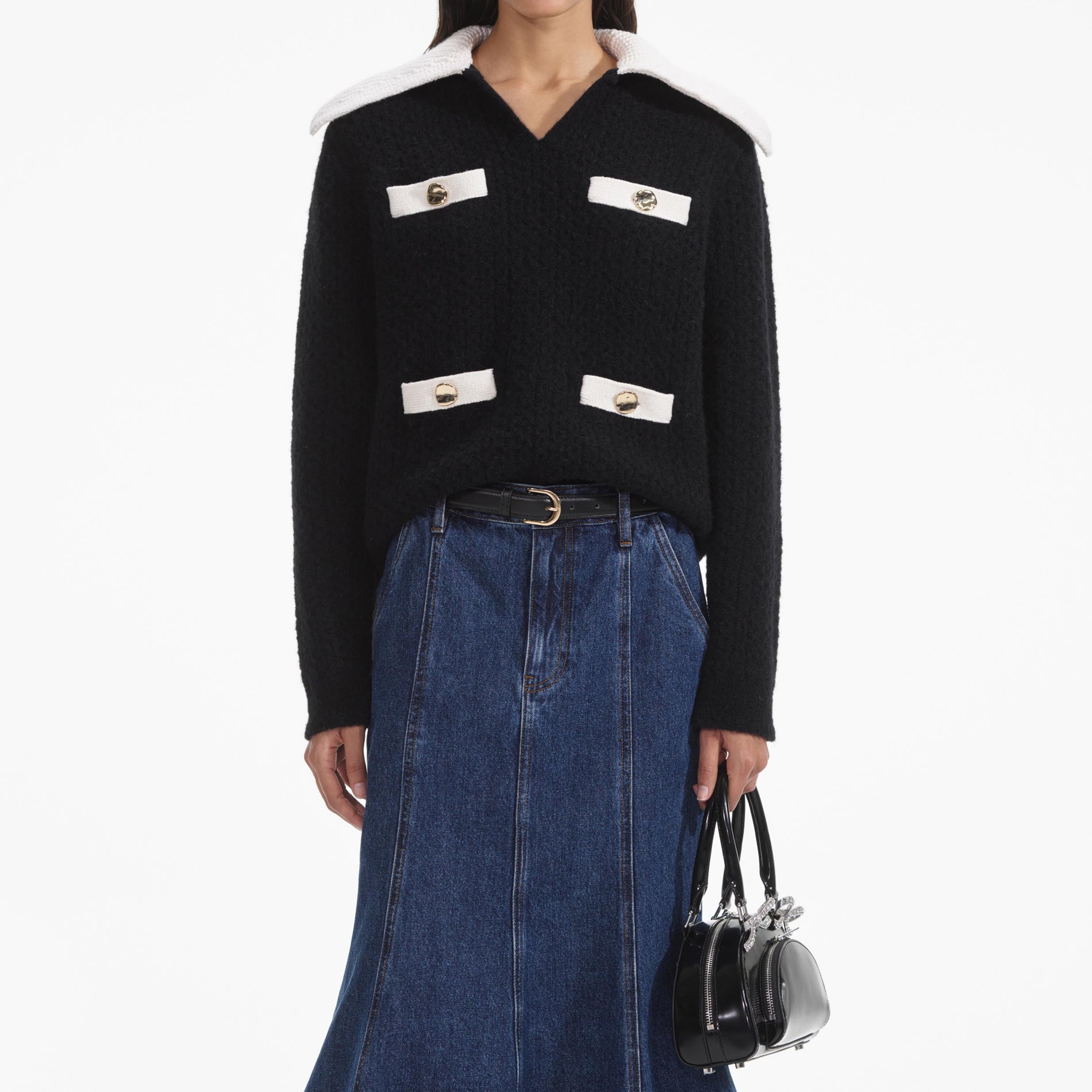 A close up of a woman wearing the Black Cashmere Blend Oversized Jumper