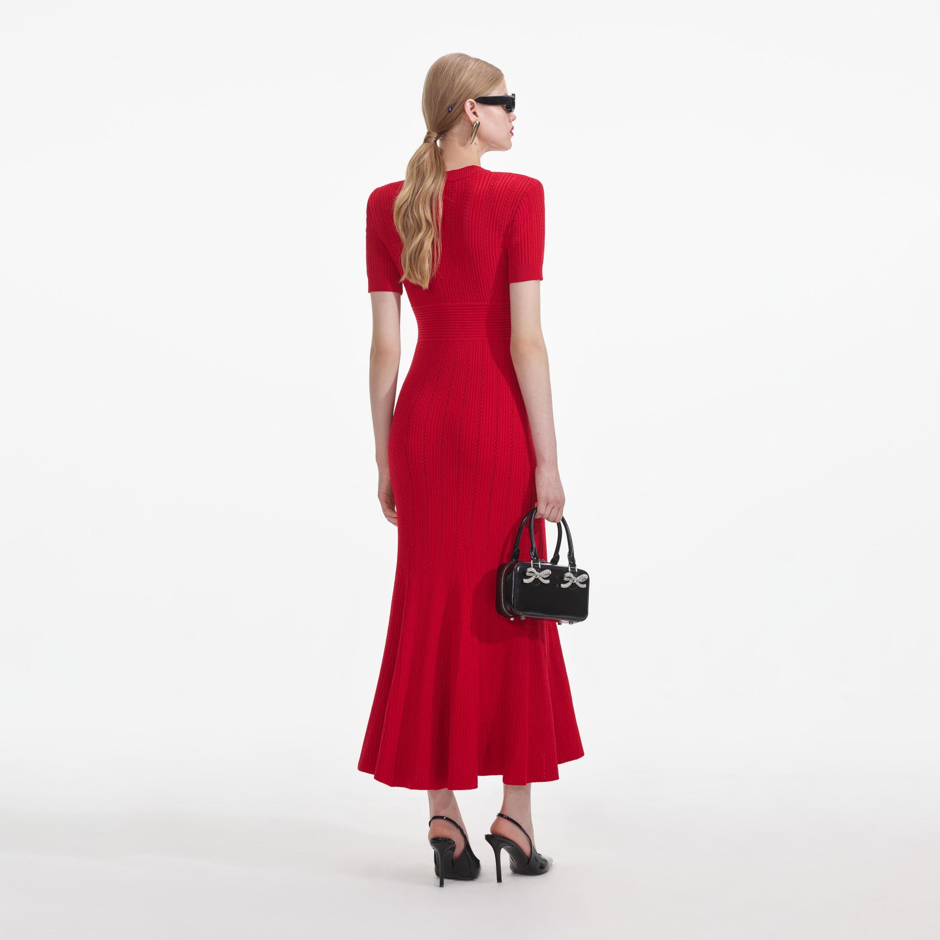 Back view of a woman wearing the Red Pointelle Knit Midi Dress