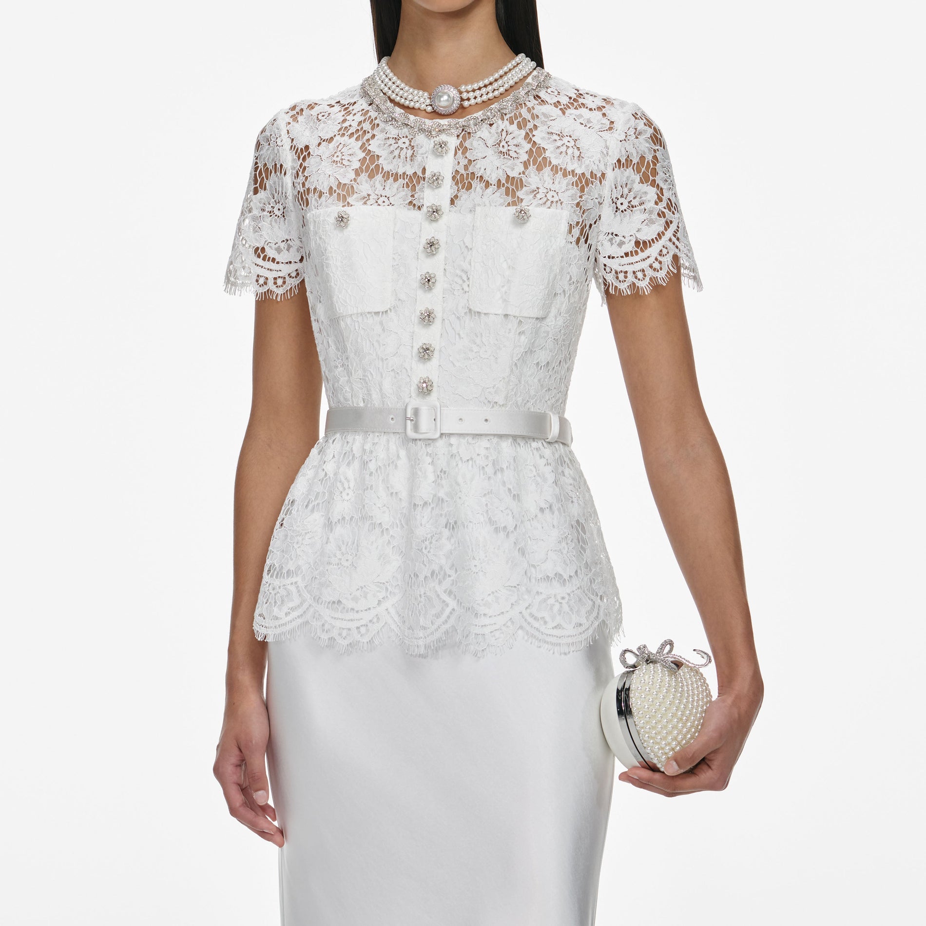 A close up of a woman wearing the White Lace Satin Maxi Dress