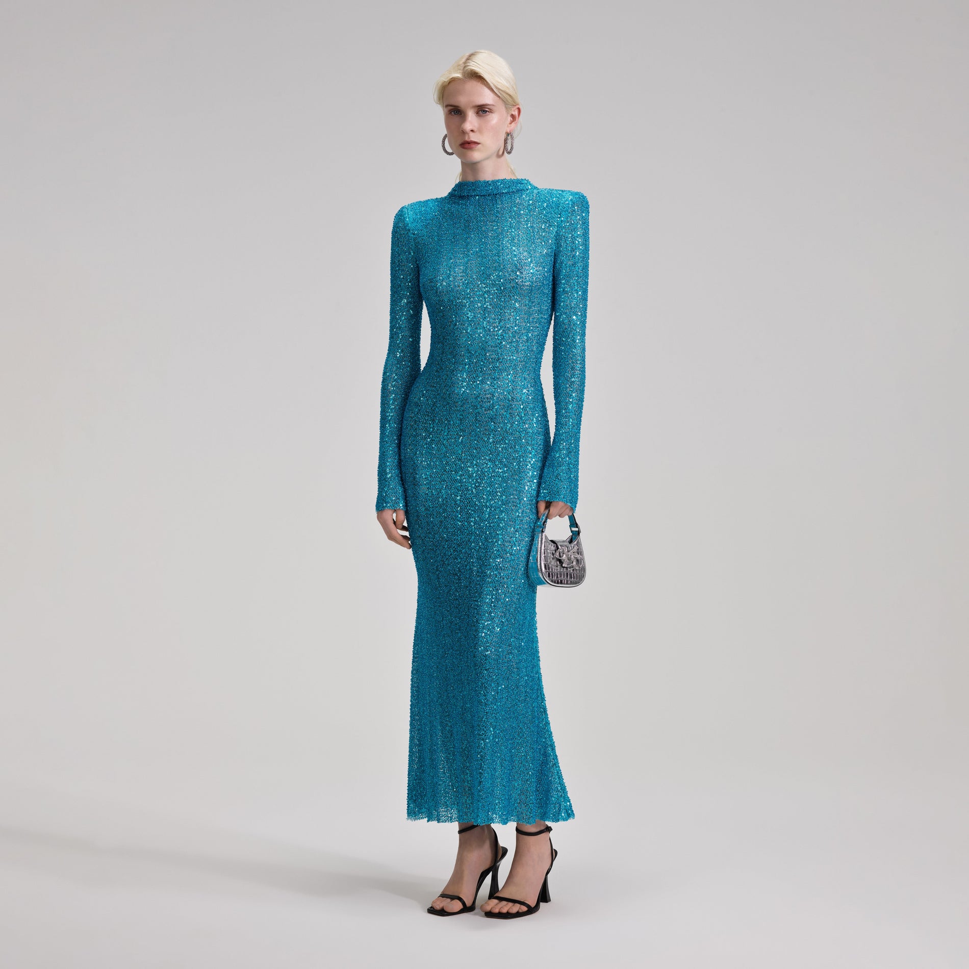 A woman wearing the Blue Beaded Maxi Dress