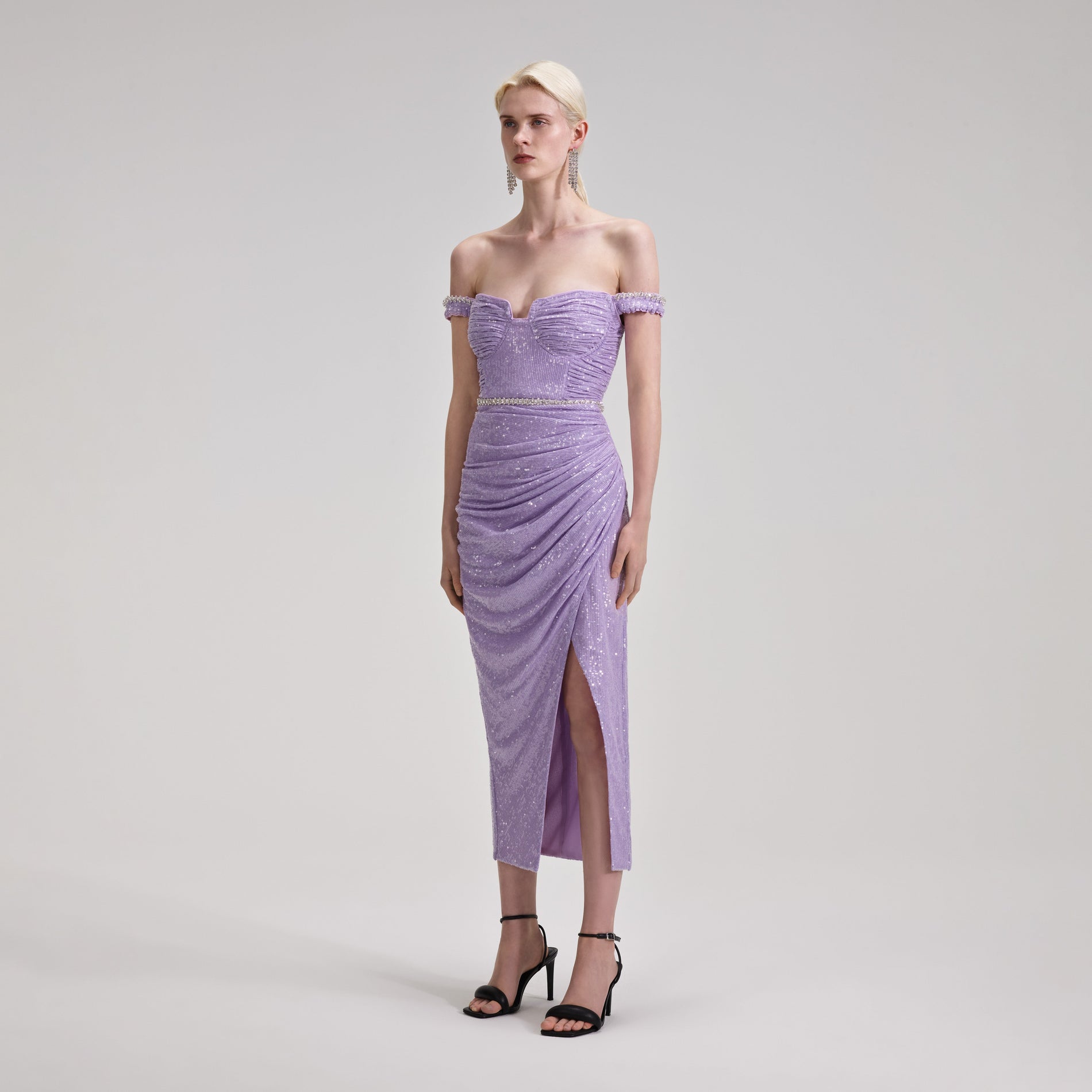 A woman wearing the Lilac Sequin Midi Dress