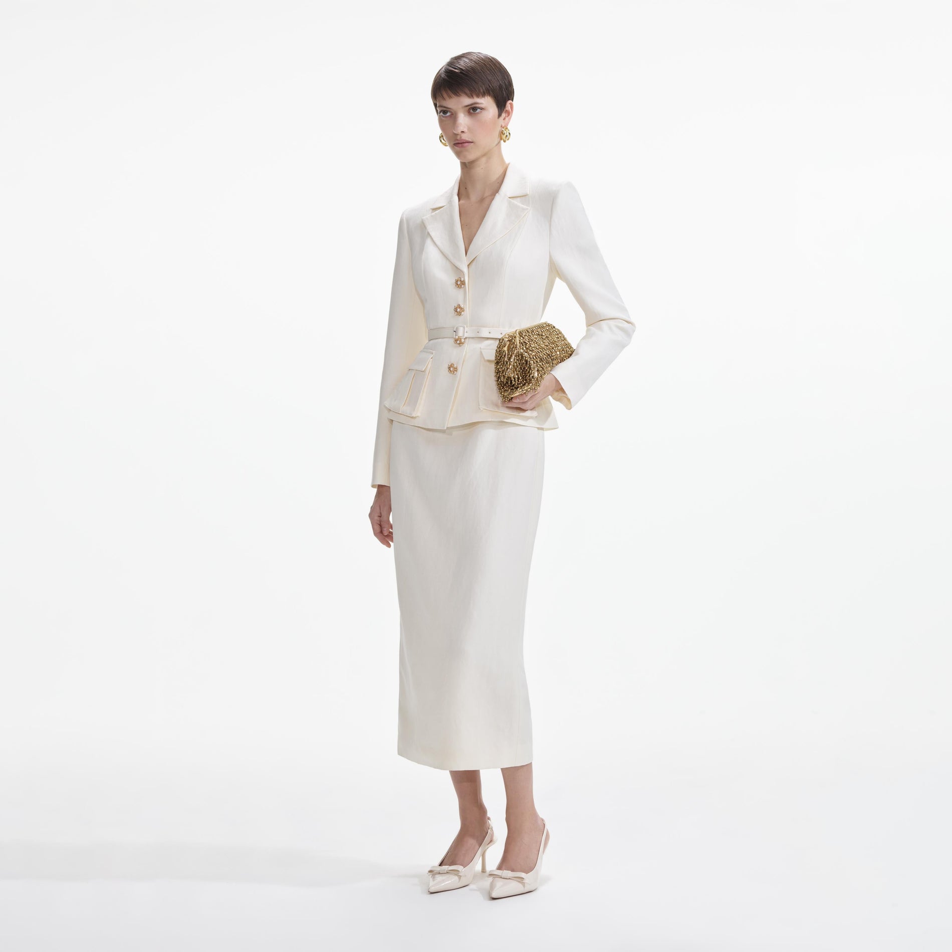 Side view of a woman wearing the Cream Linen Tailored Midi Dress