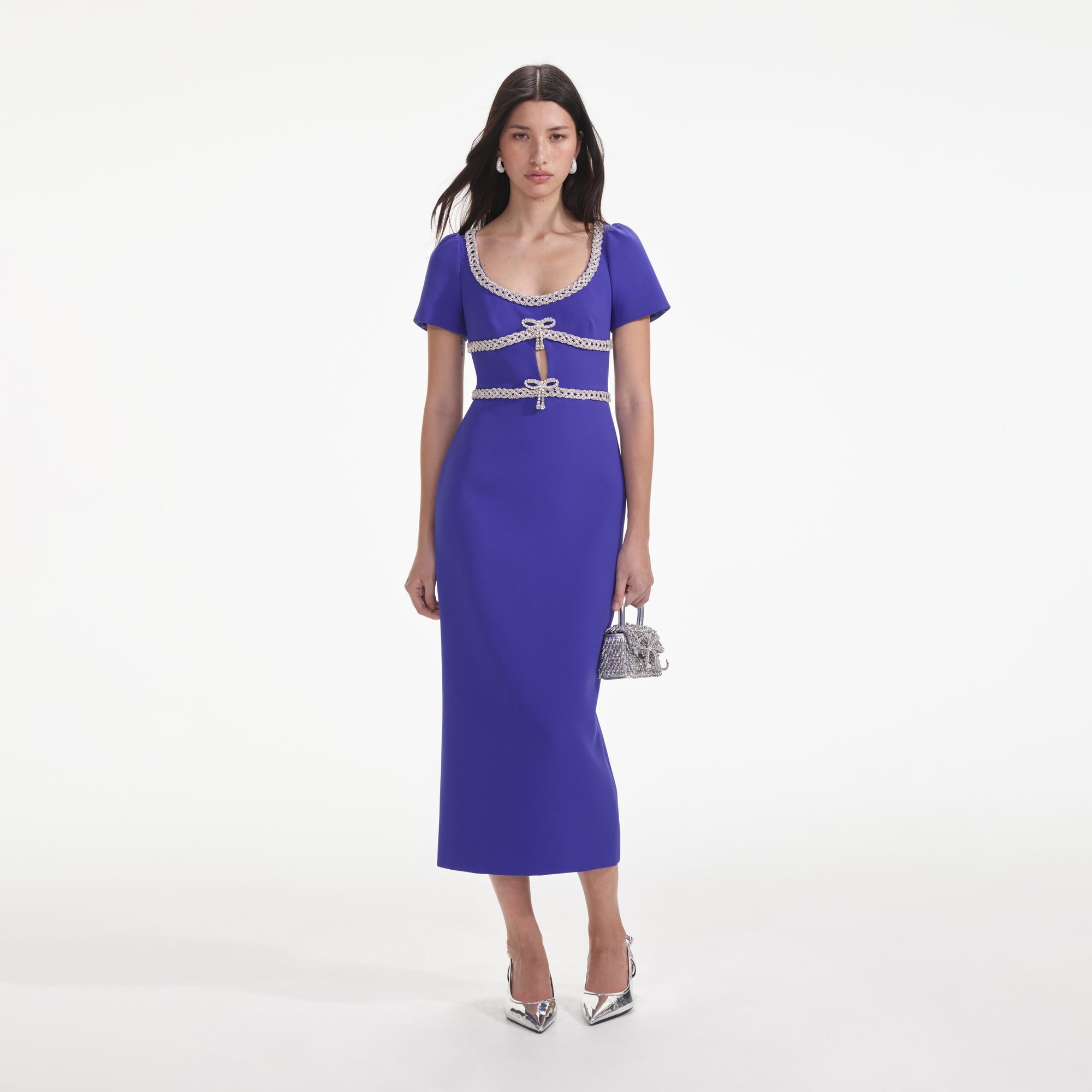 Front view of a woman wearing the Blue Diamante Bow Trim Midi Dress