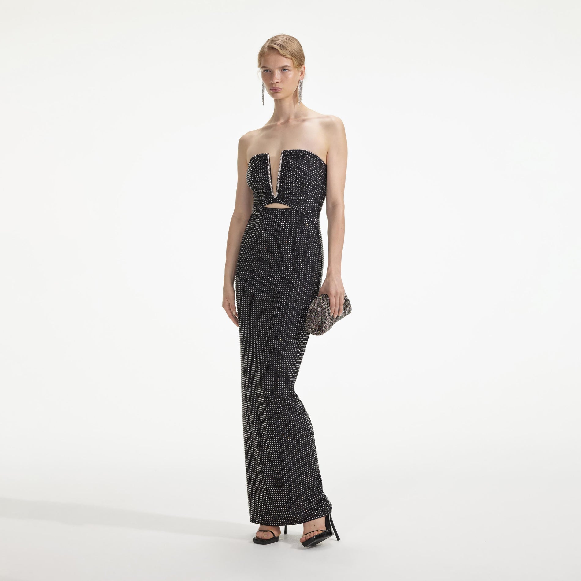 Side view of a woman wearing the Black Jersey Rhinestone Maxi Dress