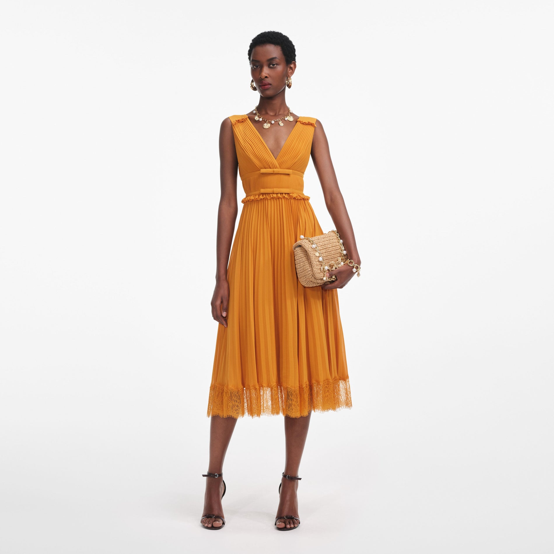 Front view of a woman wearing the Burnt Orange Chiffon Midi Dress