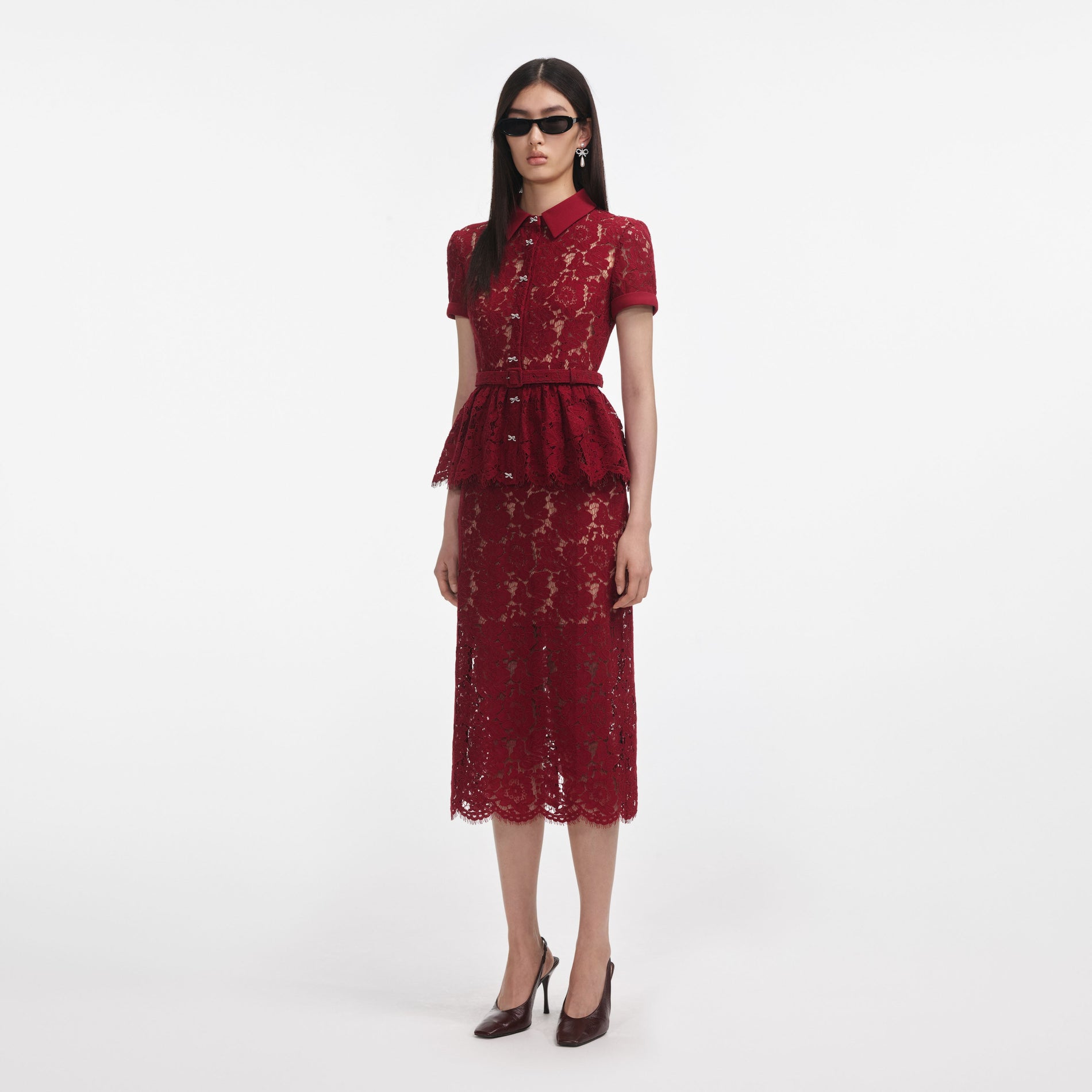 Side view of a woman wearing the Burgundy Lace Peplum Midi Dress