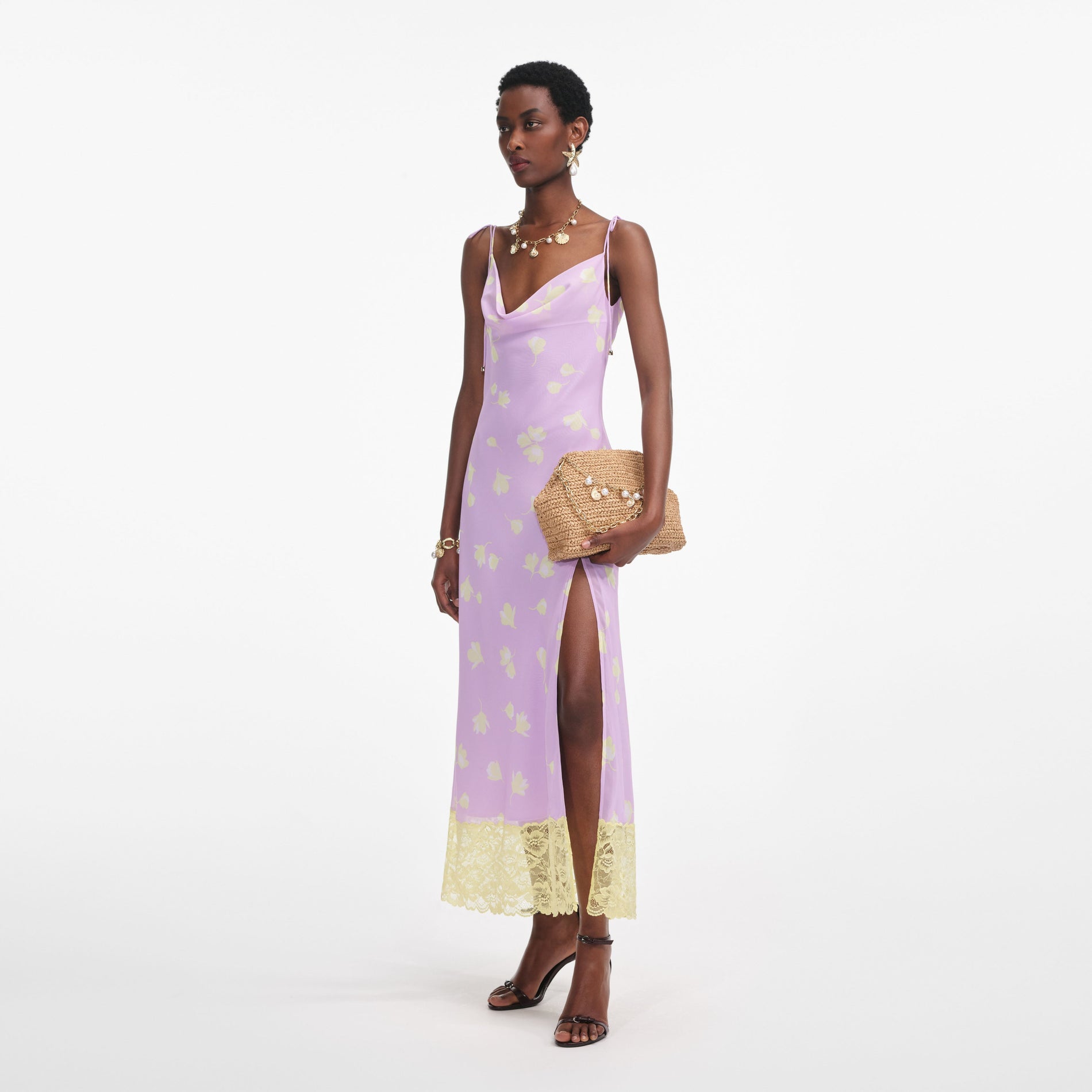 Side view of a woman wearing the Lilac Floral Chiffon Midi Dress