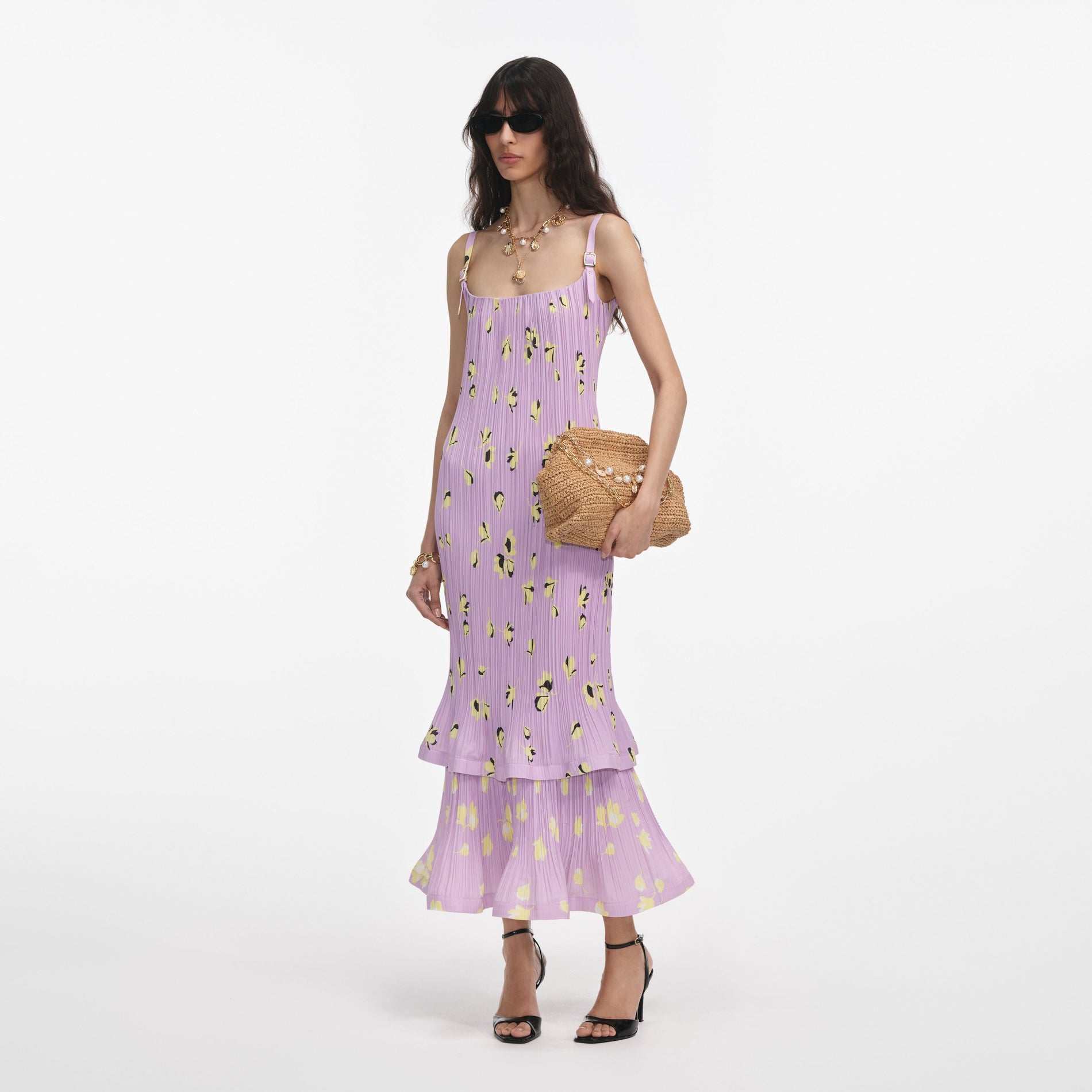 Side view of a woman wearing the Lilac Floral Plisse Midi Dress