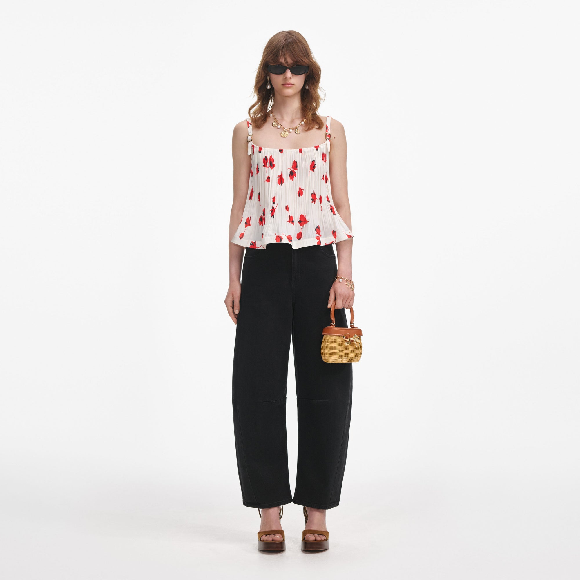 Front view of a woman wearing the Black Barrel Leg Jeans