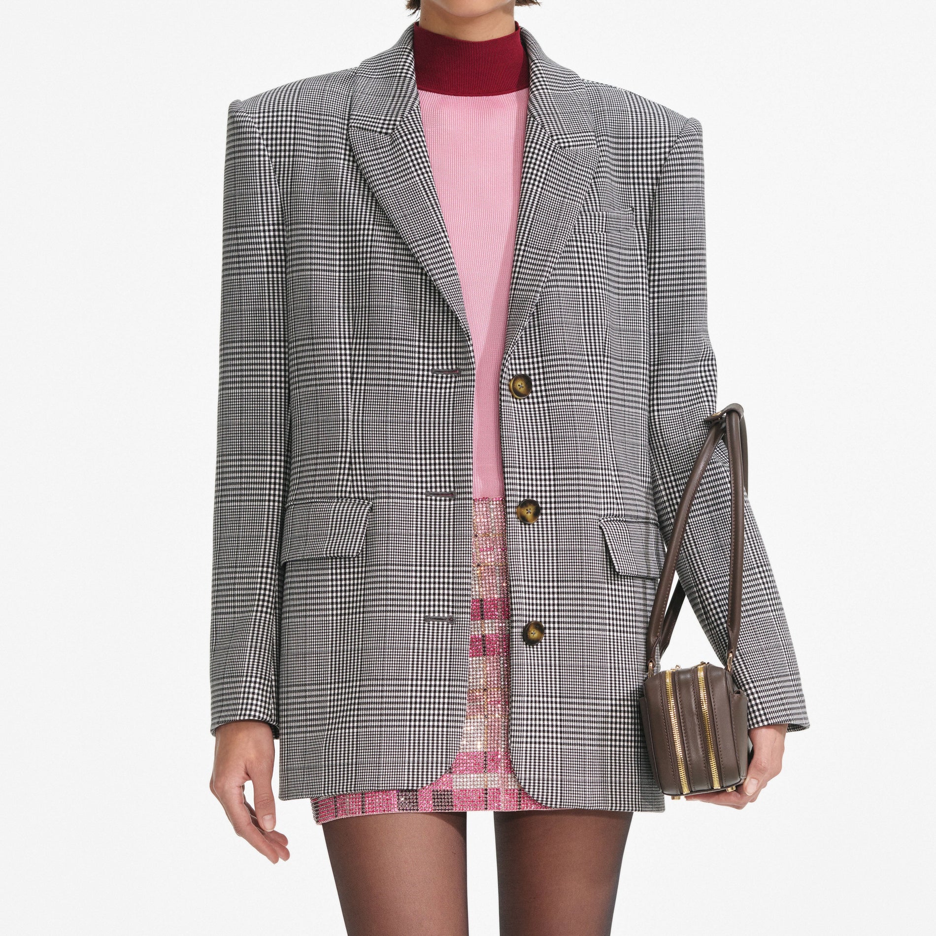 A close up of a woman wearing the Prince Of Wales Check Blazer