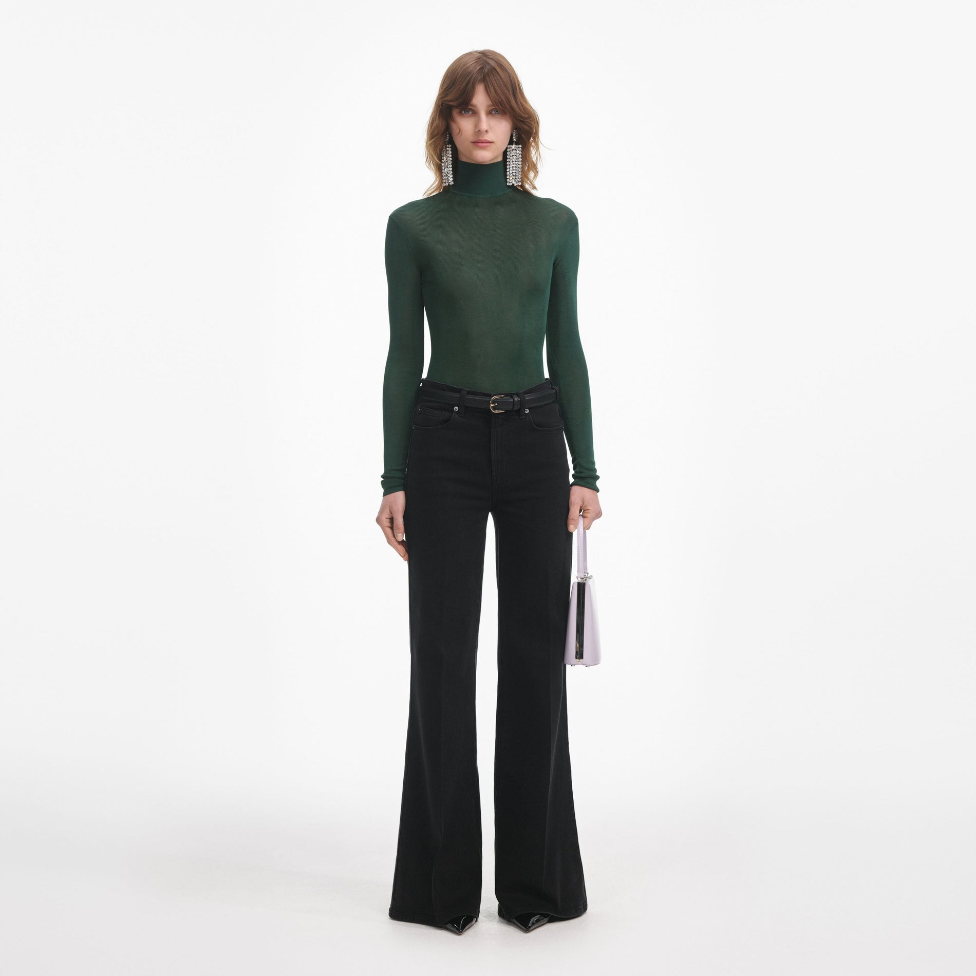 Front view of a woman wearing the Green Viscose Knit Top