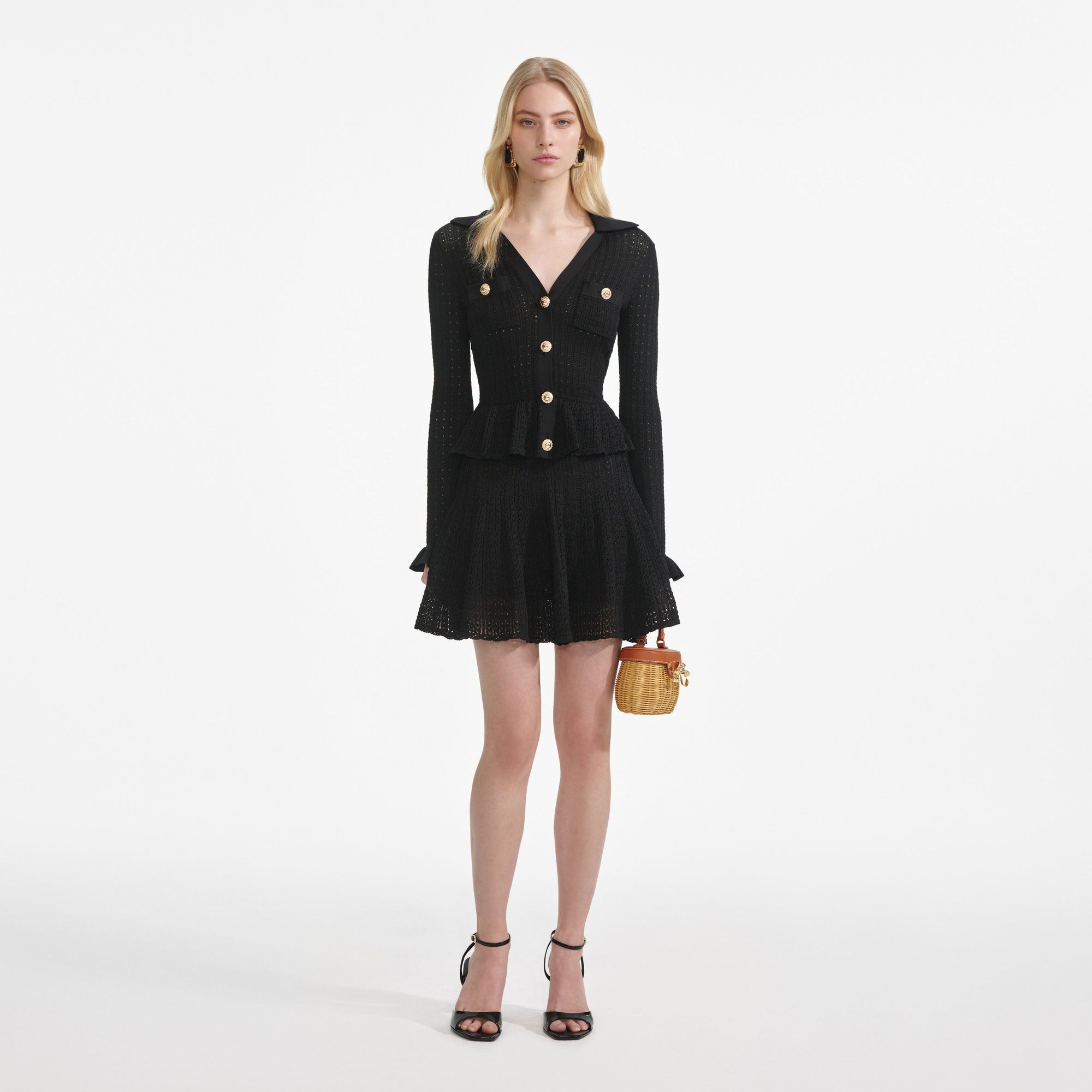 Front view of a woman wearing the Black Pointelle V Neck Knit Mini Dress