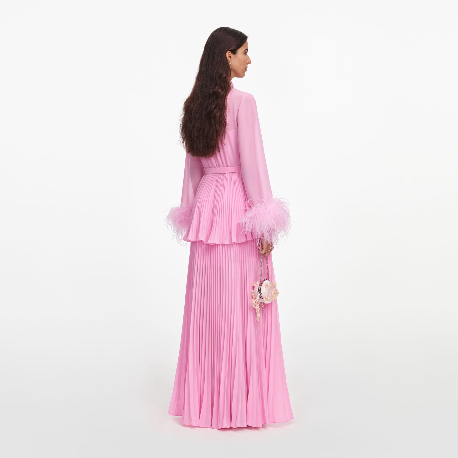 Back view of a woman wearing the Pink Georgette Feather Cuff Maxi Dress