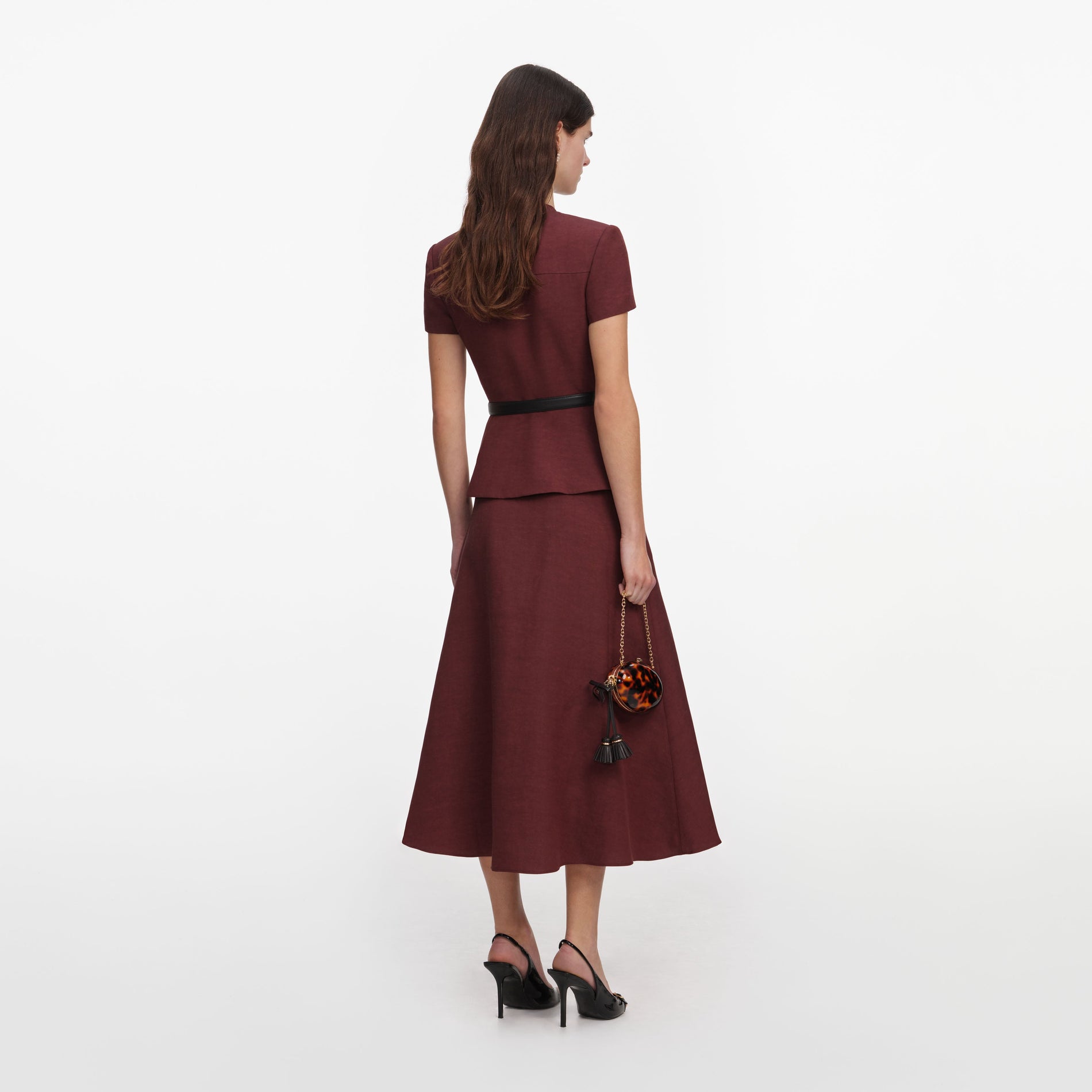 Back view of a woman wearing the Brown Peplum Linen Blend Midi Dress
