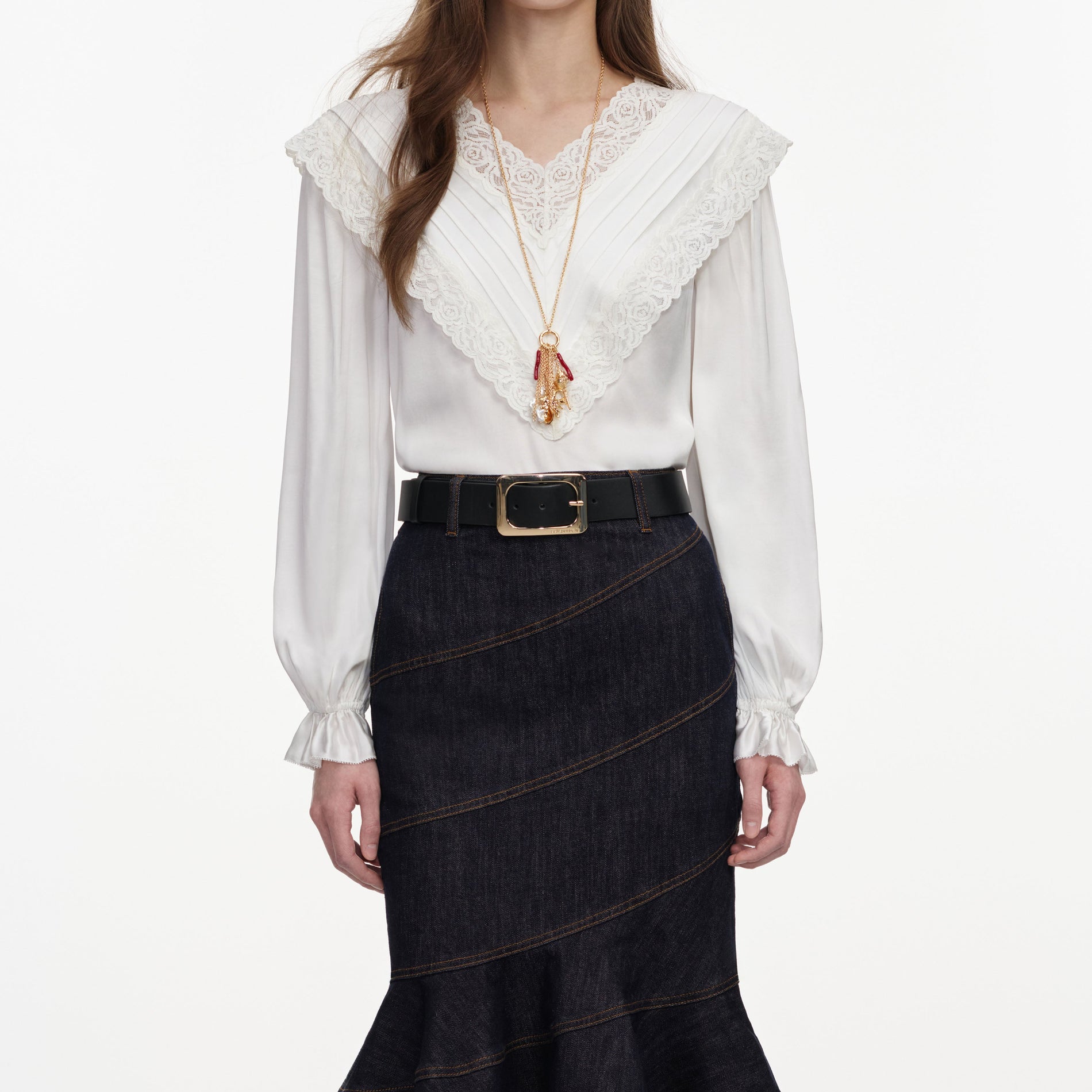 A close up of a woman wearing the Cream Viscose Lace Top