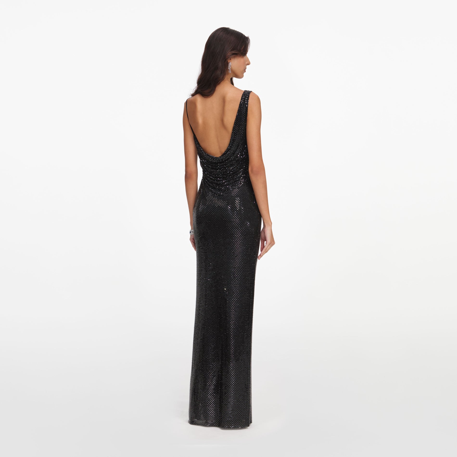 Back view of a woman wearing the Black Rhinestone Draped Maxi Dress